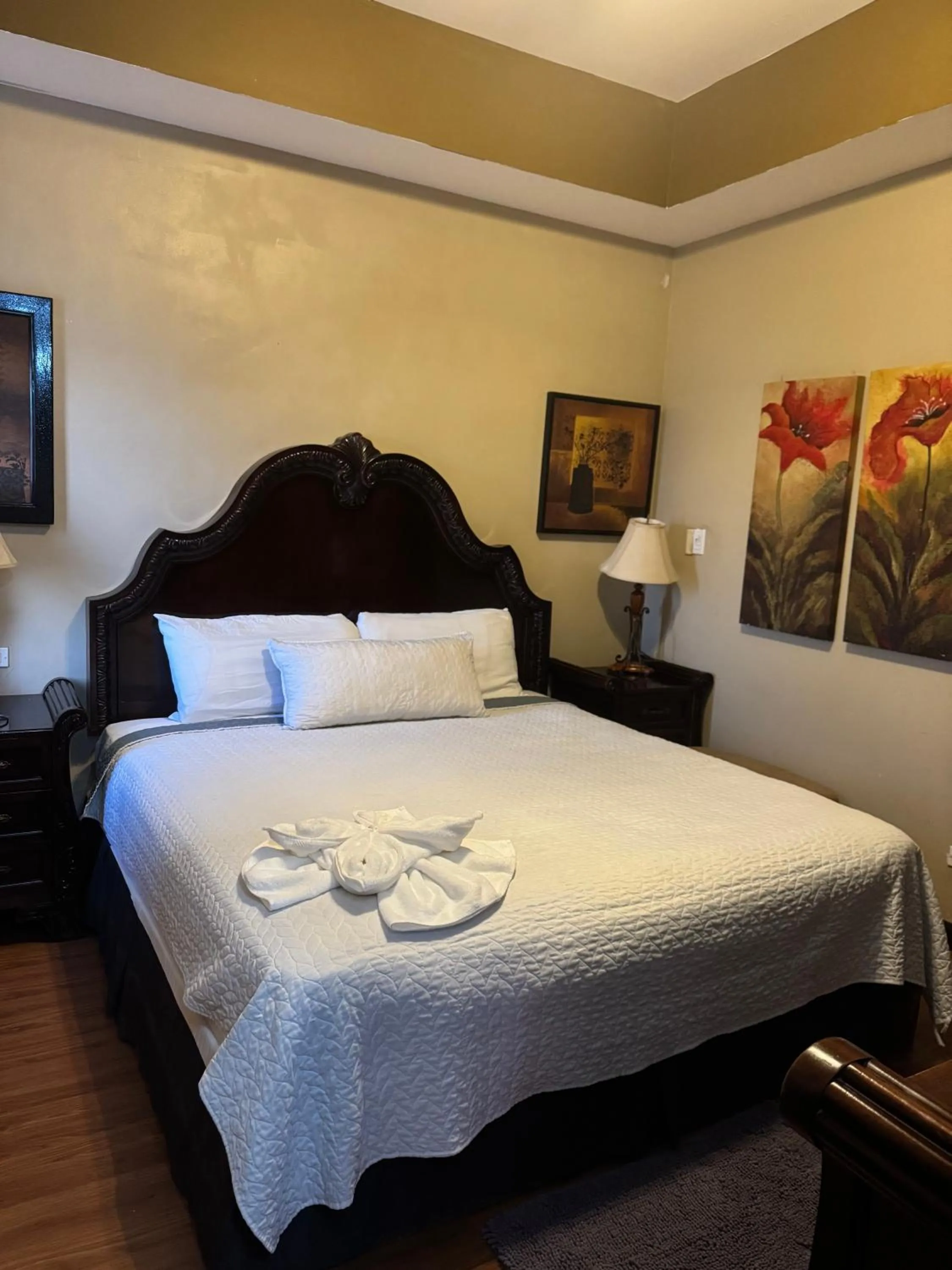 Bed in Hotel Royal Blue & Golf Cart Rental