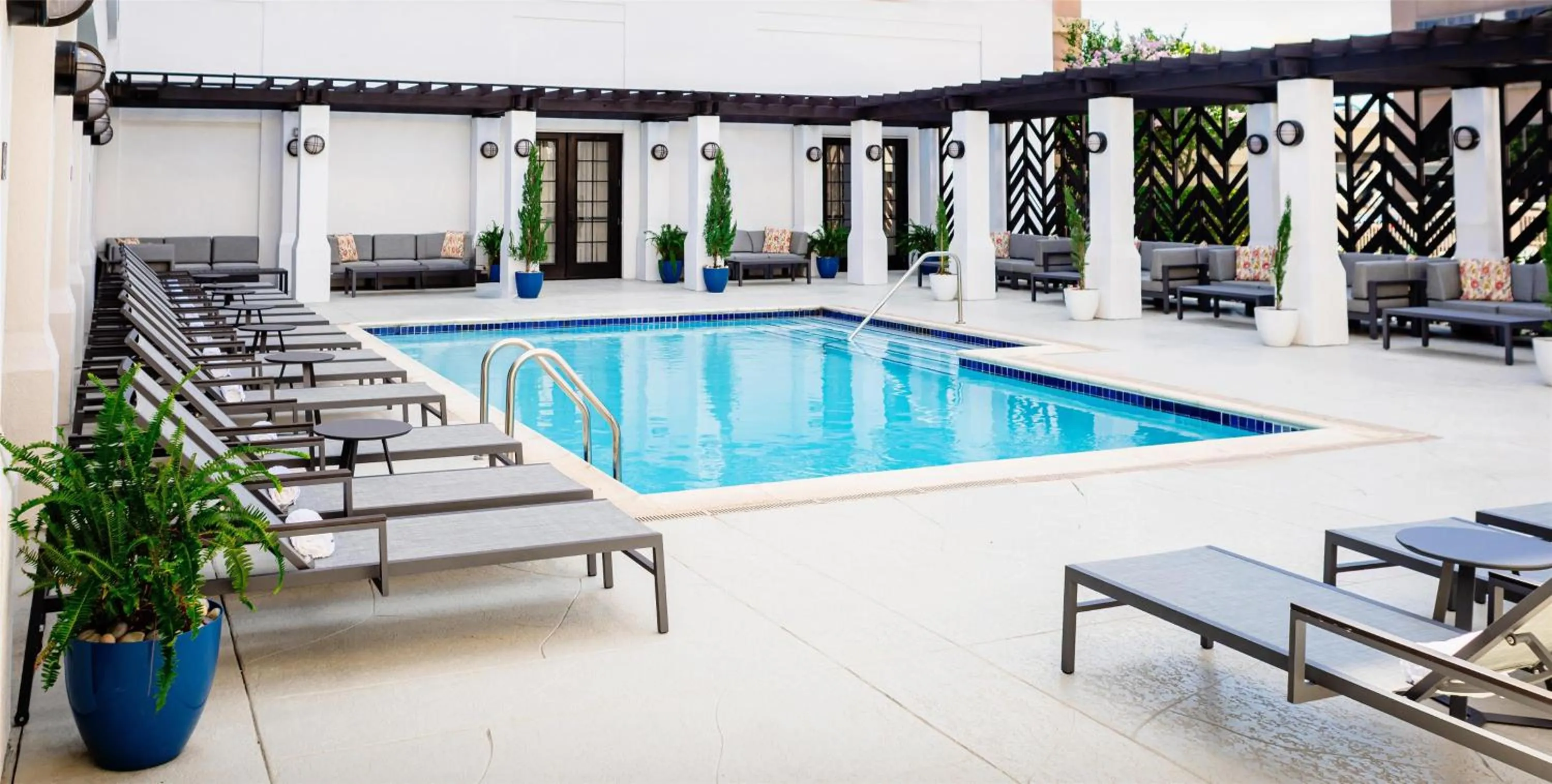 Pool view in The Chifley Houston, Tapestry Collection by Hilton