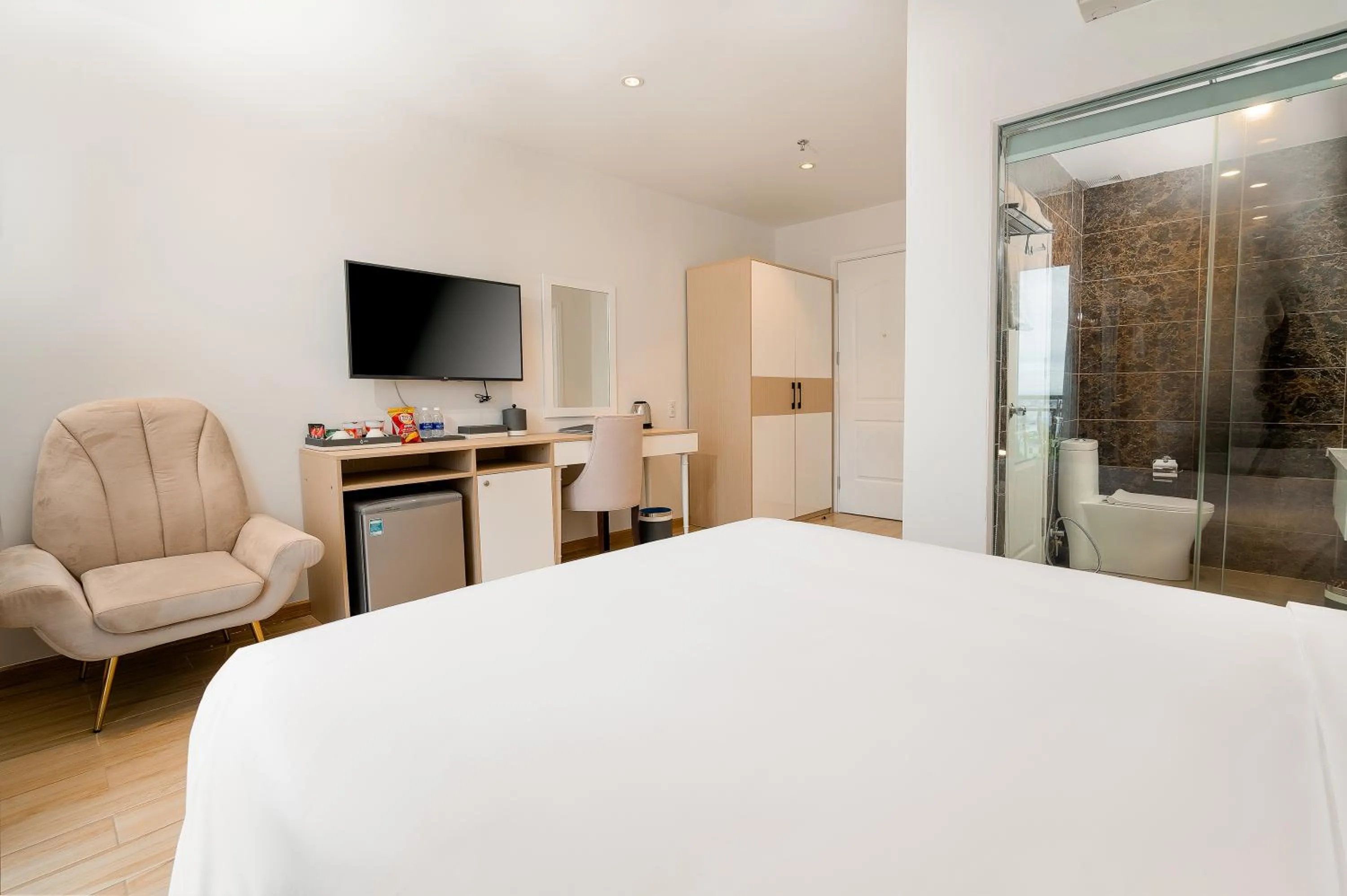 Bed in RHM Luxury Hotel And Suite