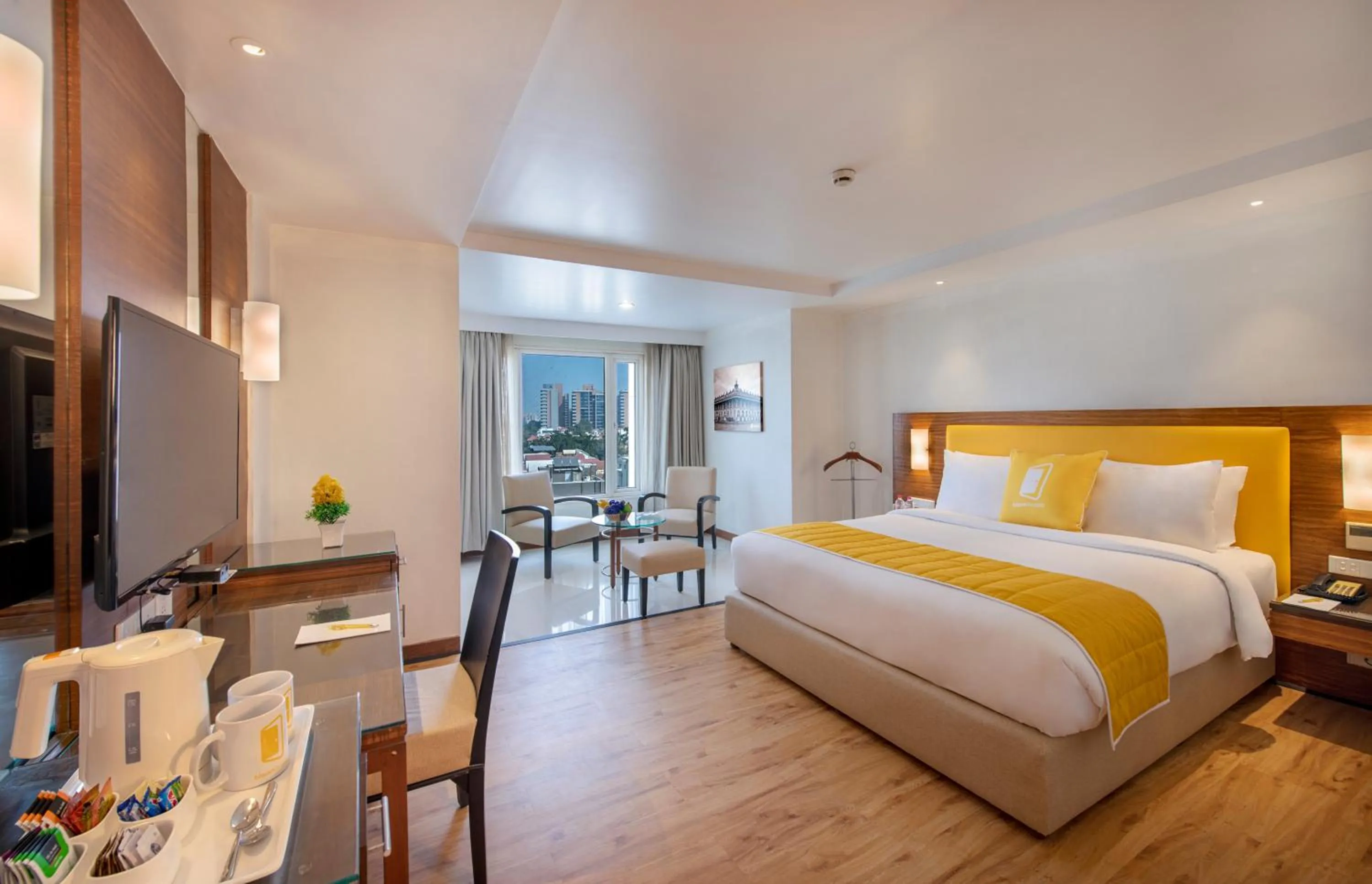 Photo of the whole room, Bed in BloomSuites l Ahmedabad