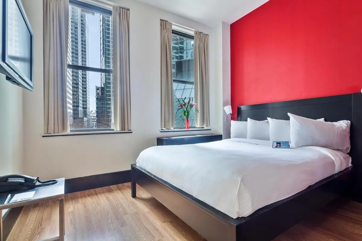 Bed in Eurostars Wall Street