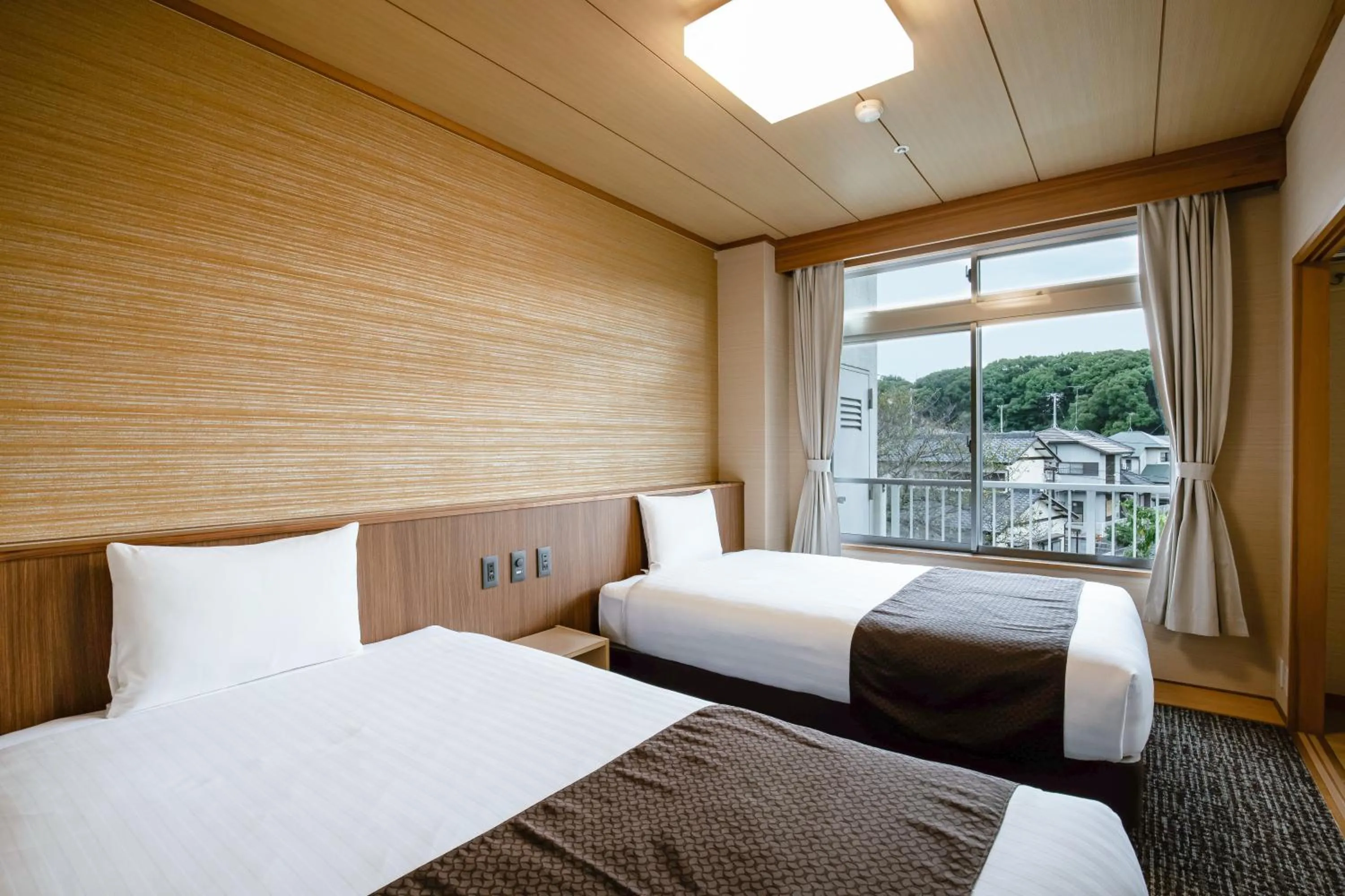 Bed in KAMENOI HOTEL Kanonji