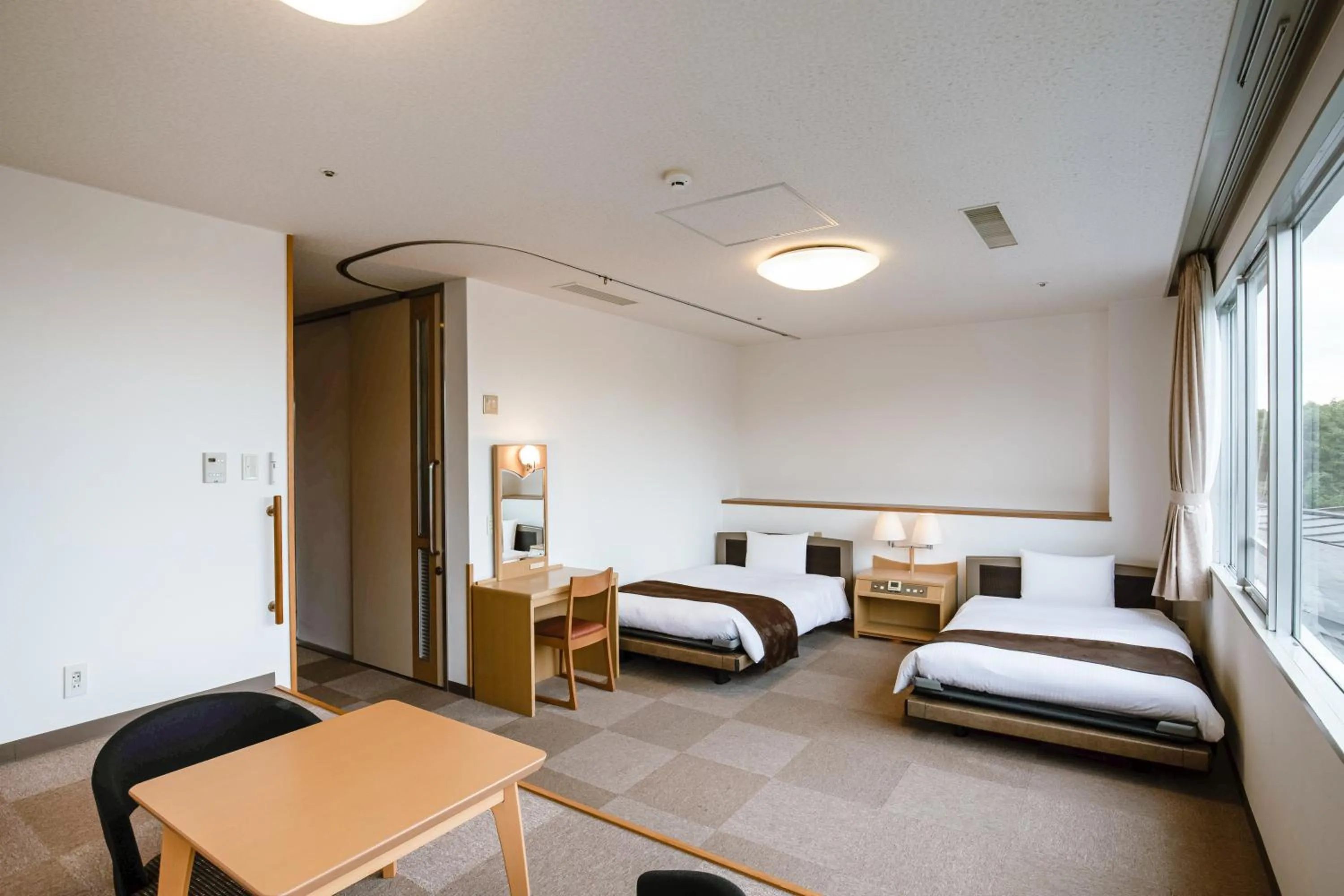 Bed in KAMENOI HOTEL Kanonji