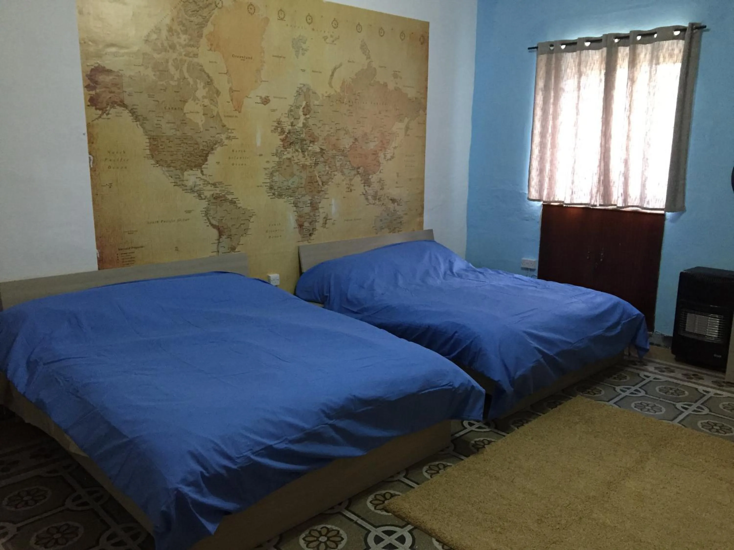 Bed in Sunrise Apartment