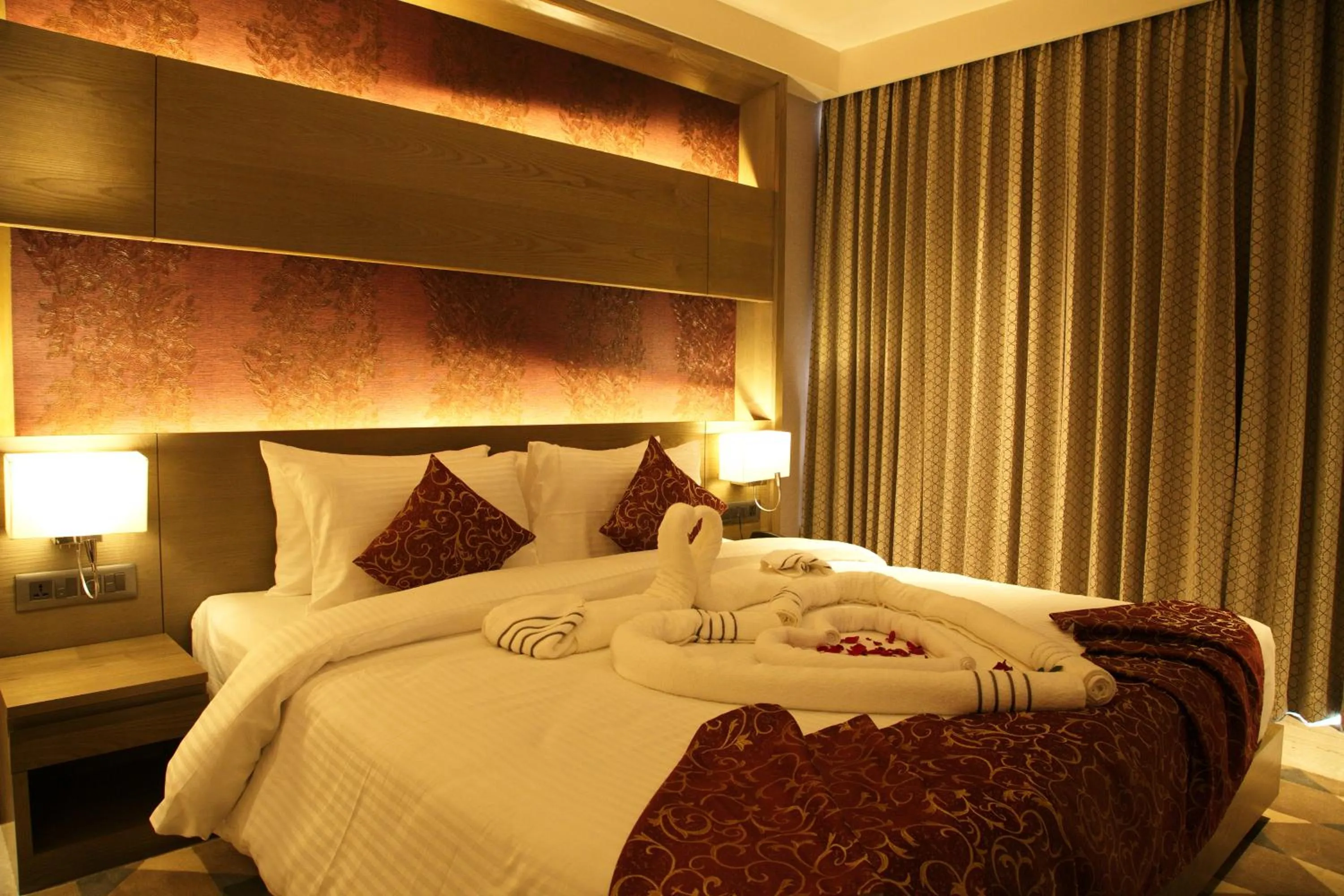 Bed in Hotel Grand Kadamba