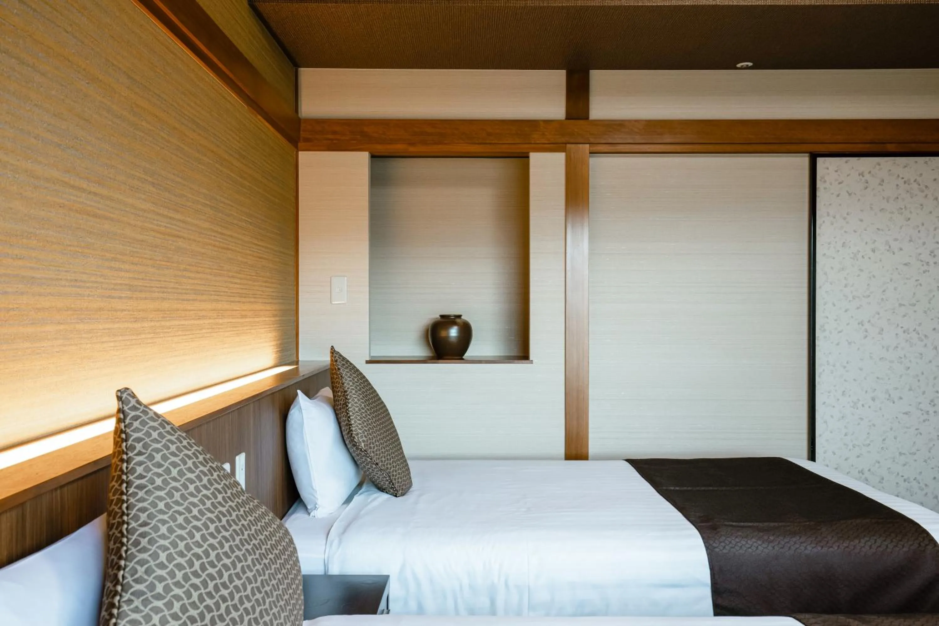 Bed in KAMENOI HOTEL Kochi