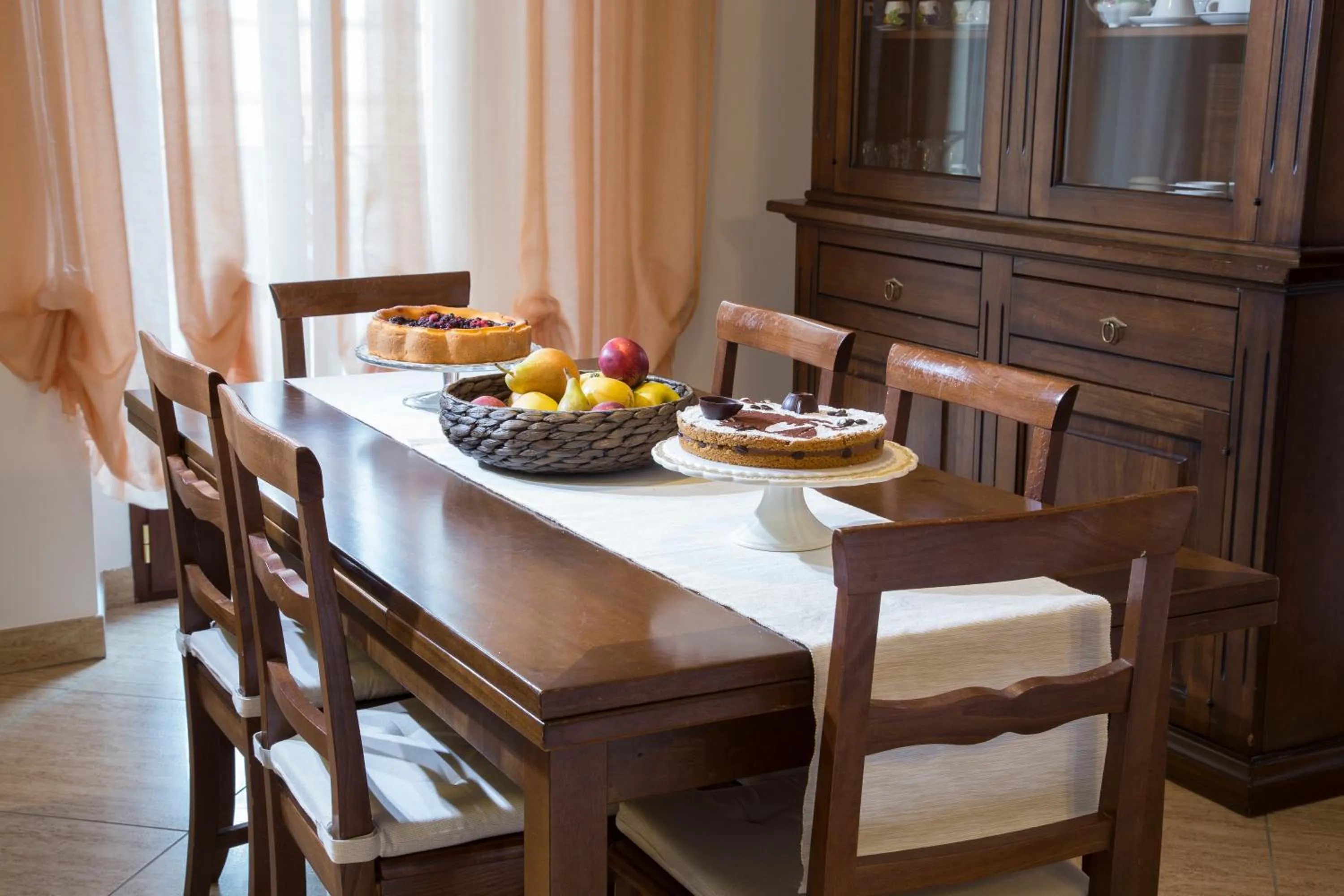 Communal lounge/ TV room in B&B Casa Cavour