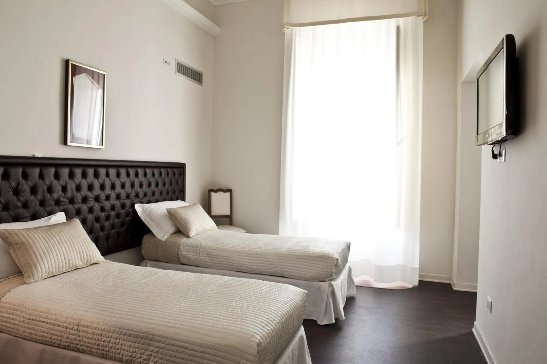 Photo of the whole room, Bed in Dimora Novecento