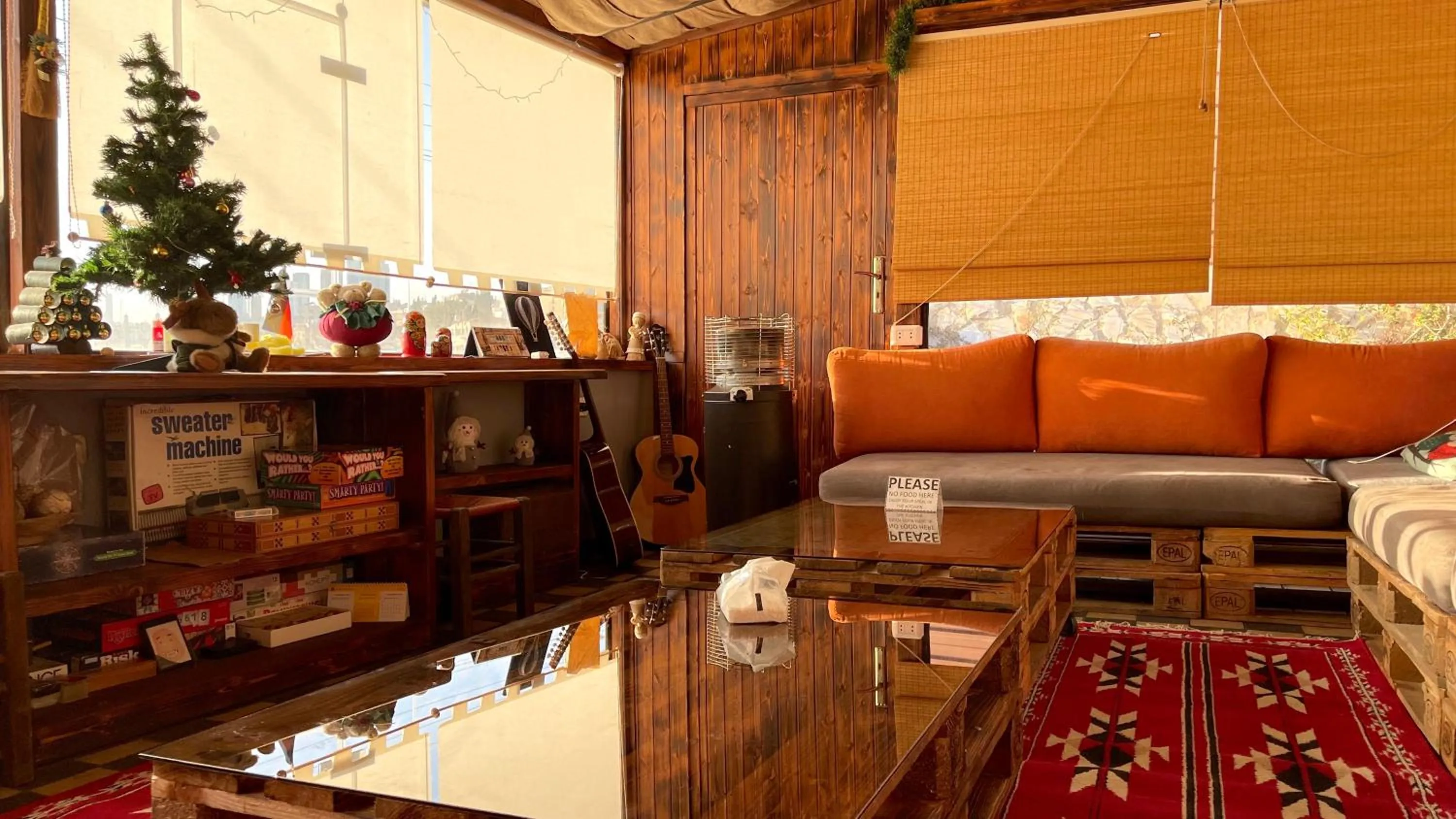 Communal lounge/ TV room in Carob Hostel