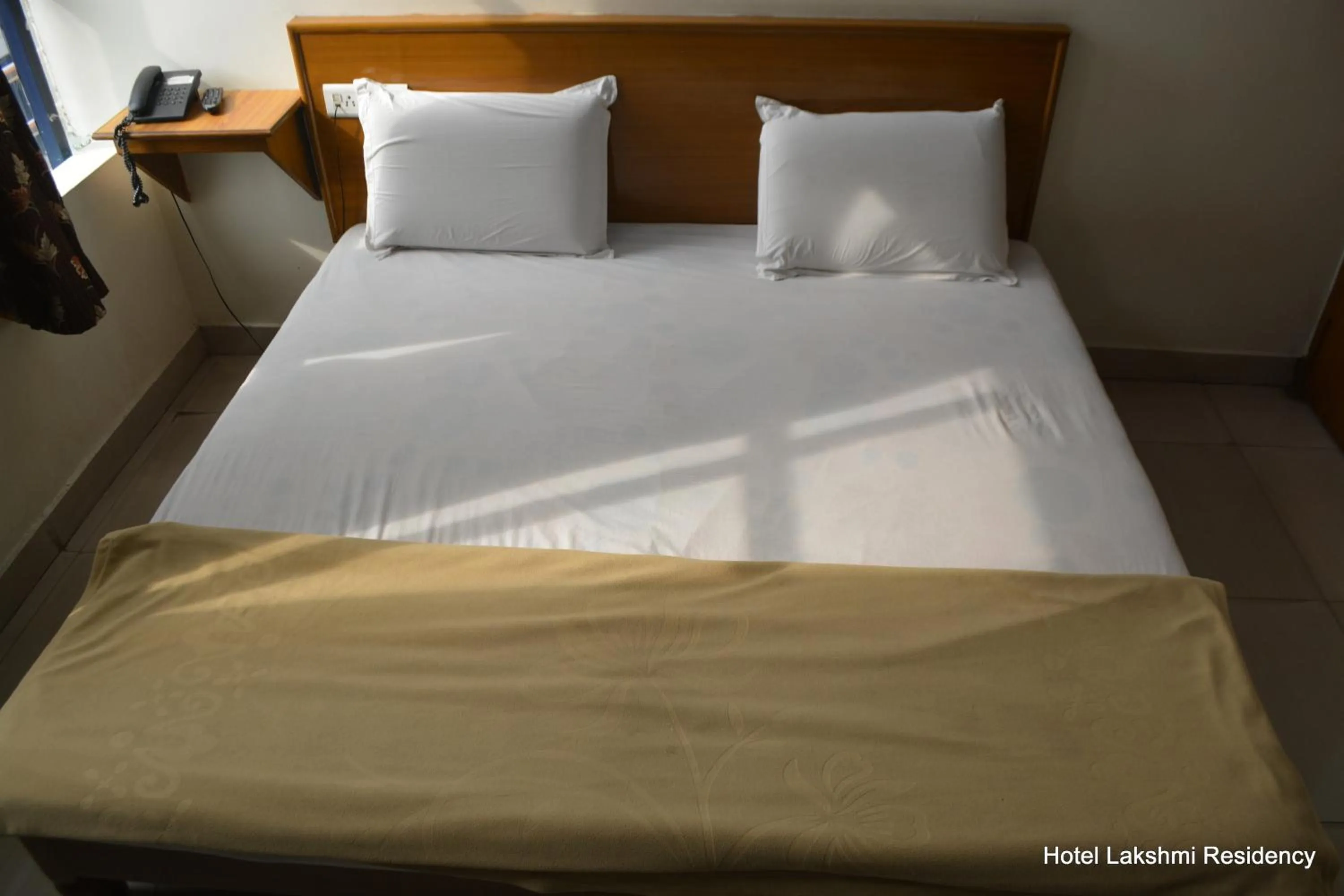 Bed in Hotel Lakshmi Residency
