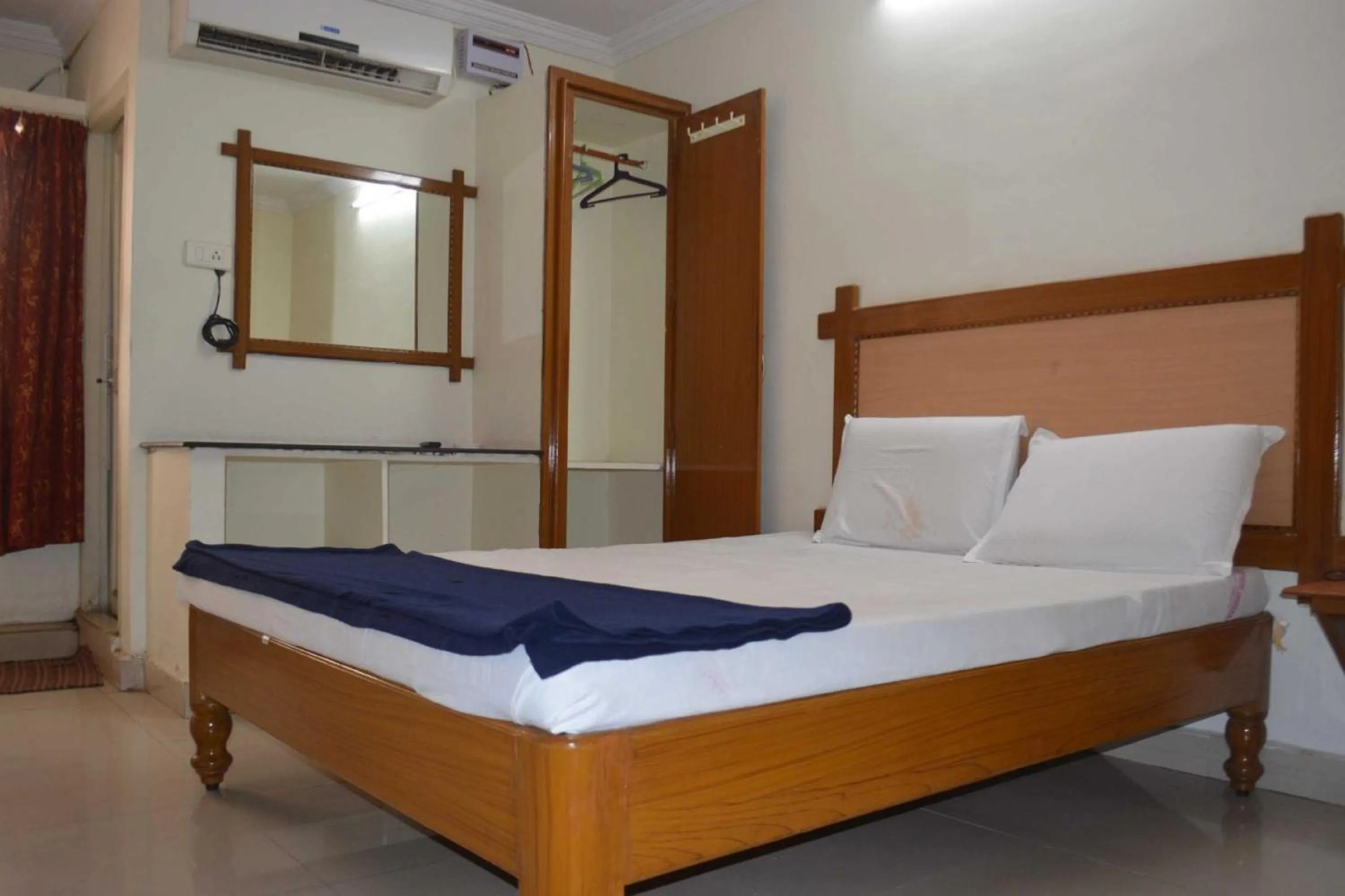 Bed in Hotel Lakshmi Residency