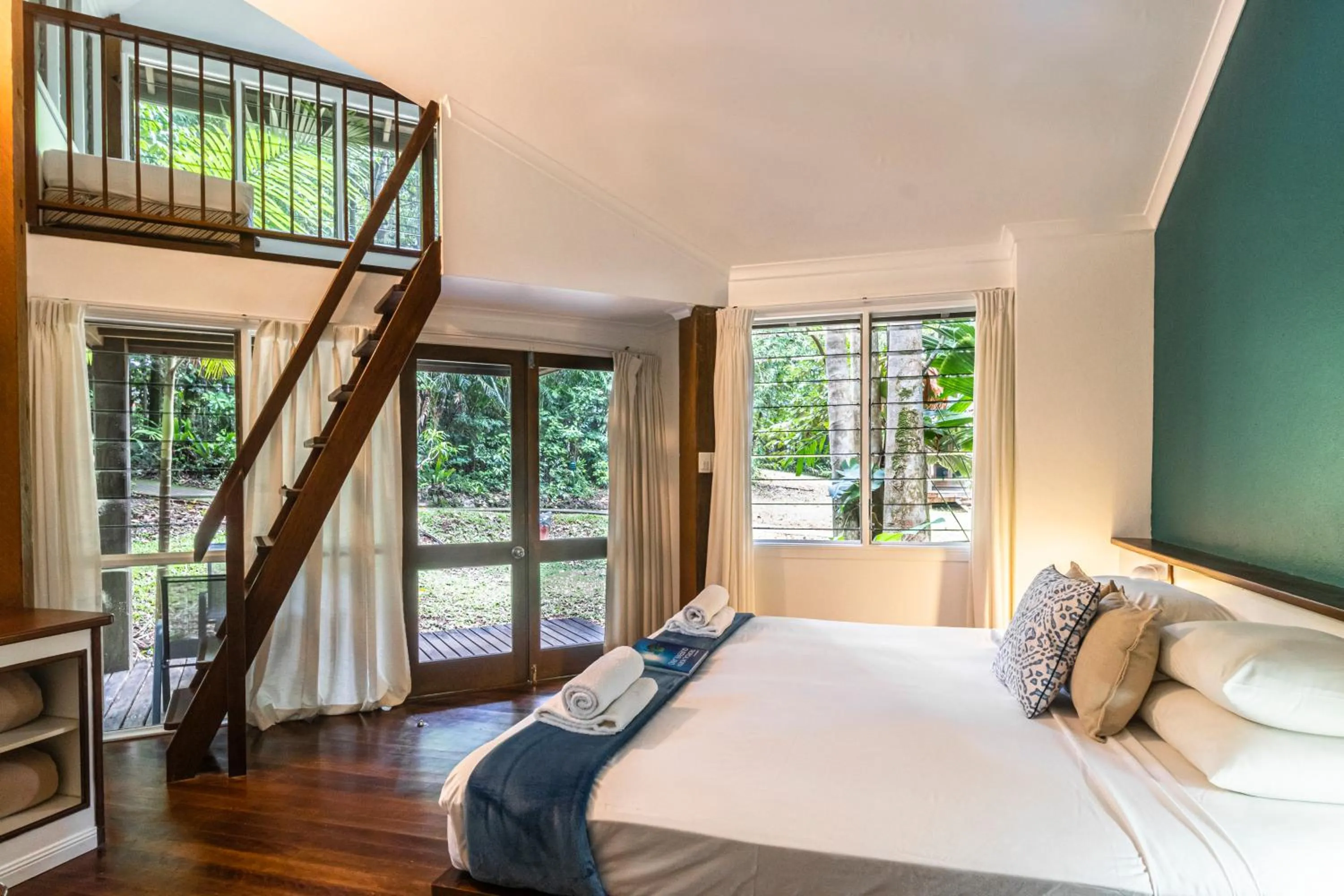 Bed in Ferntree Rainforest Lodge