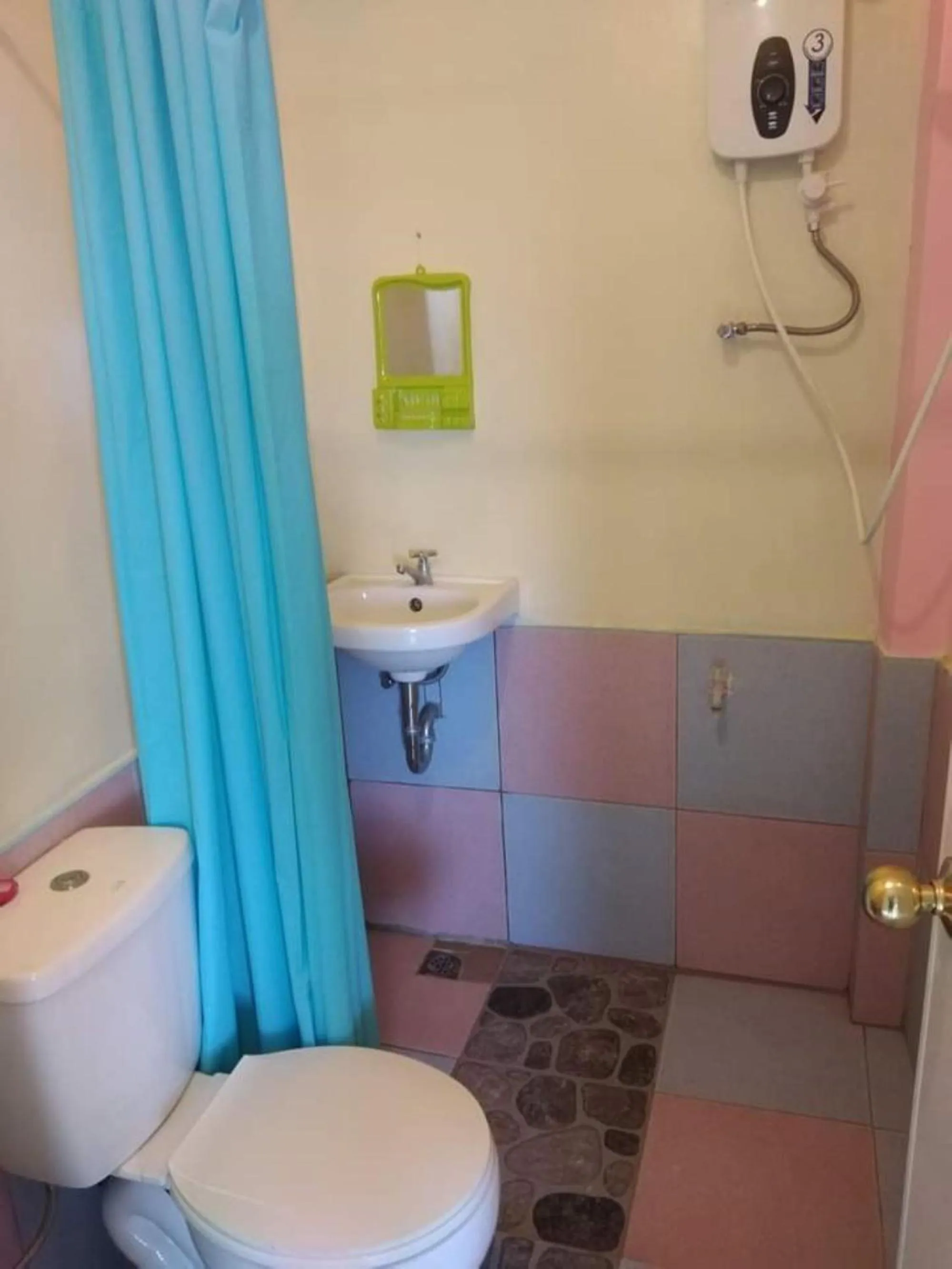 Shower in Basio's Place Tourist Inn by RedDoorz