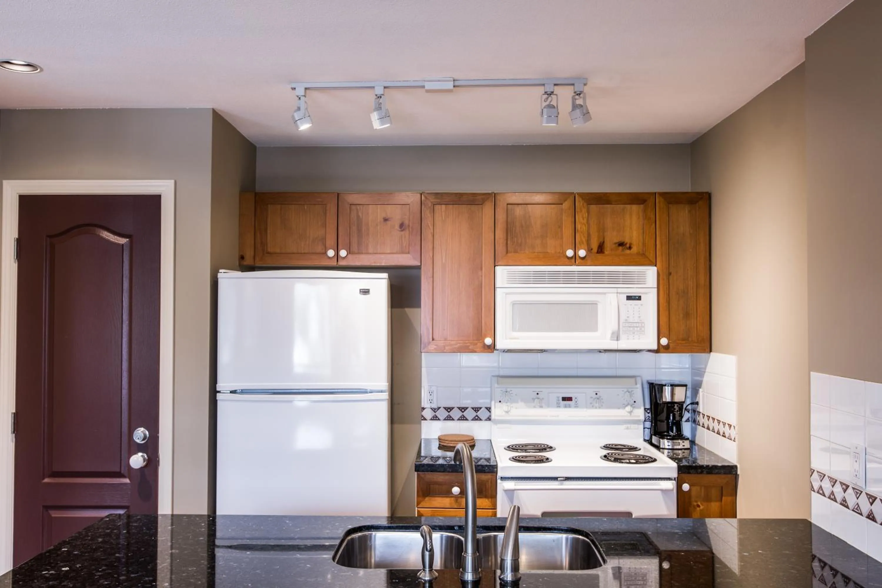 Kitchen or kitchenette in Whistler Blackcomb Vacation Rentals - Village North