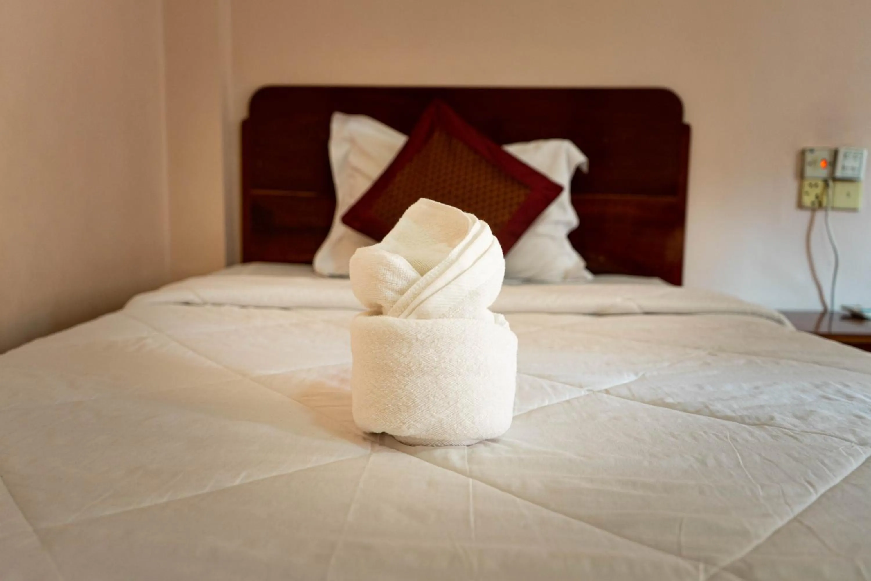 Bed in Nawin Palace Guesthouse