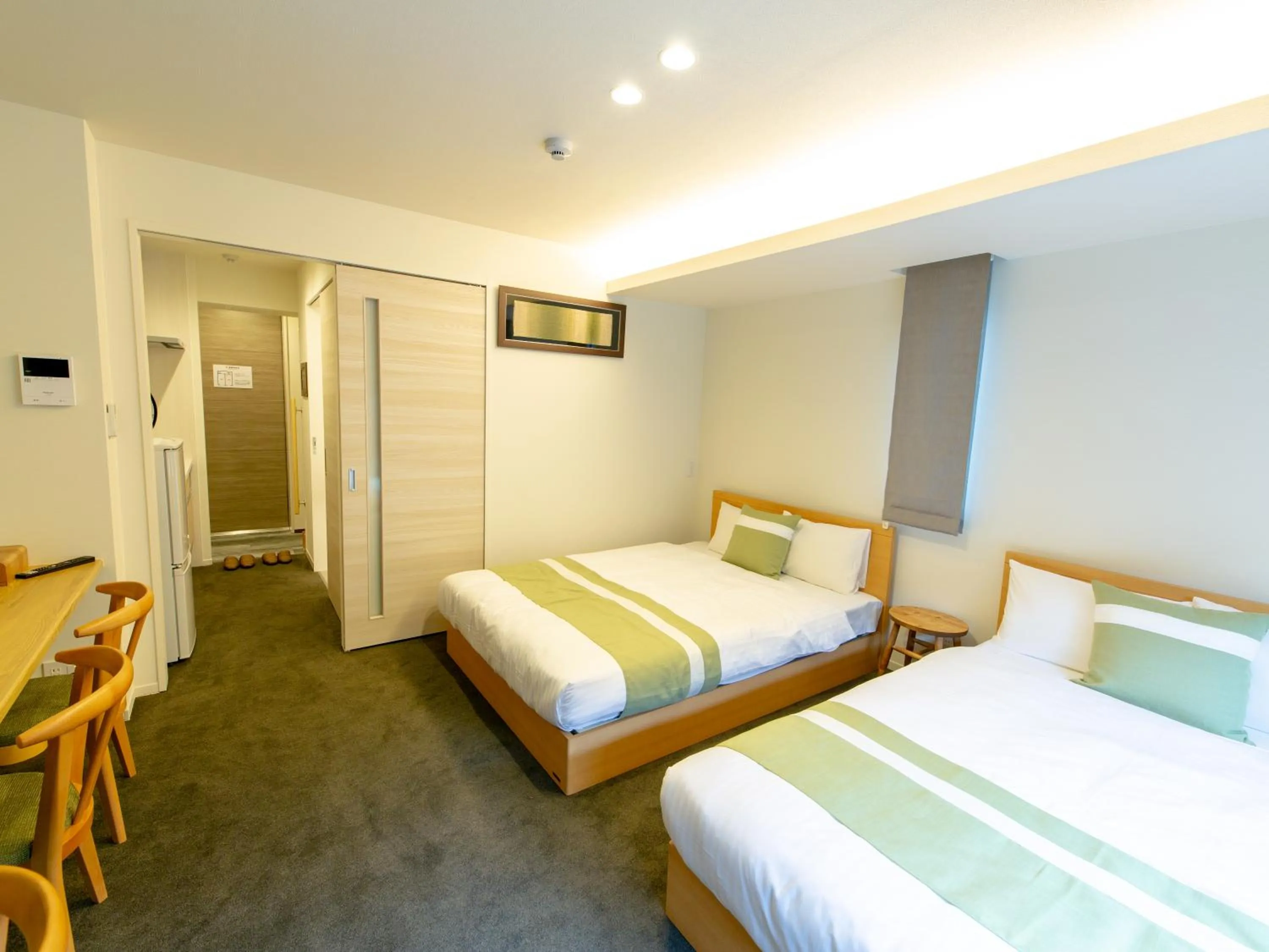 Photo of the whole room, Bed in GRAND BASE Hiroshima Ekimae