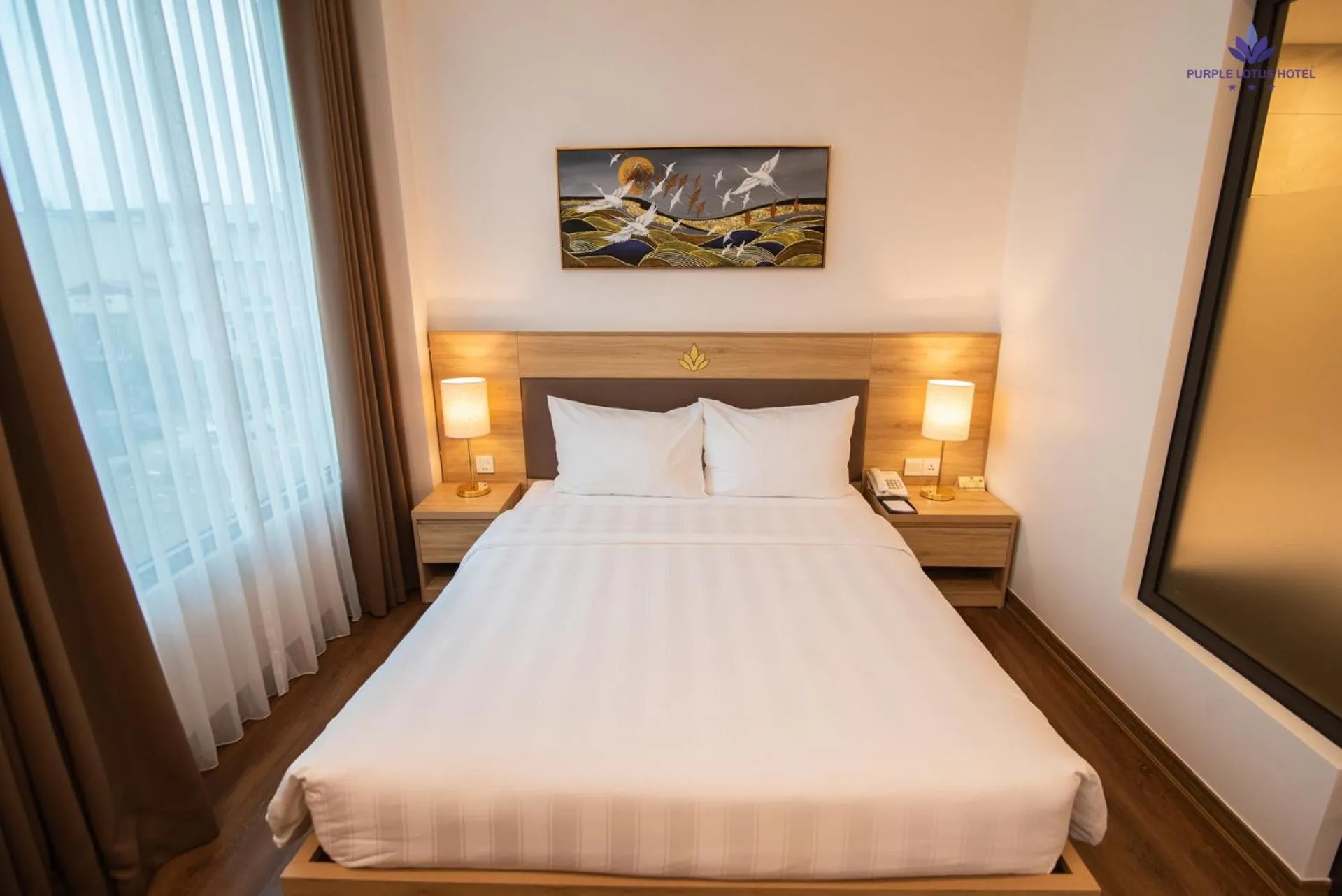 Bed in Purple Lotus Hotel