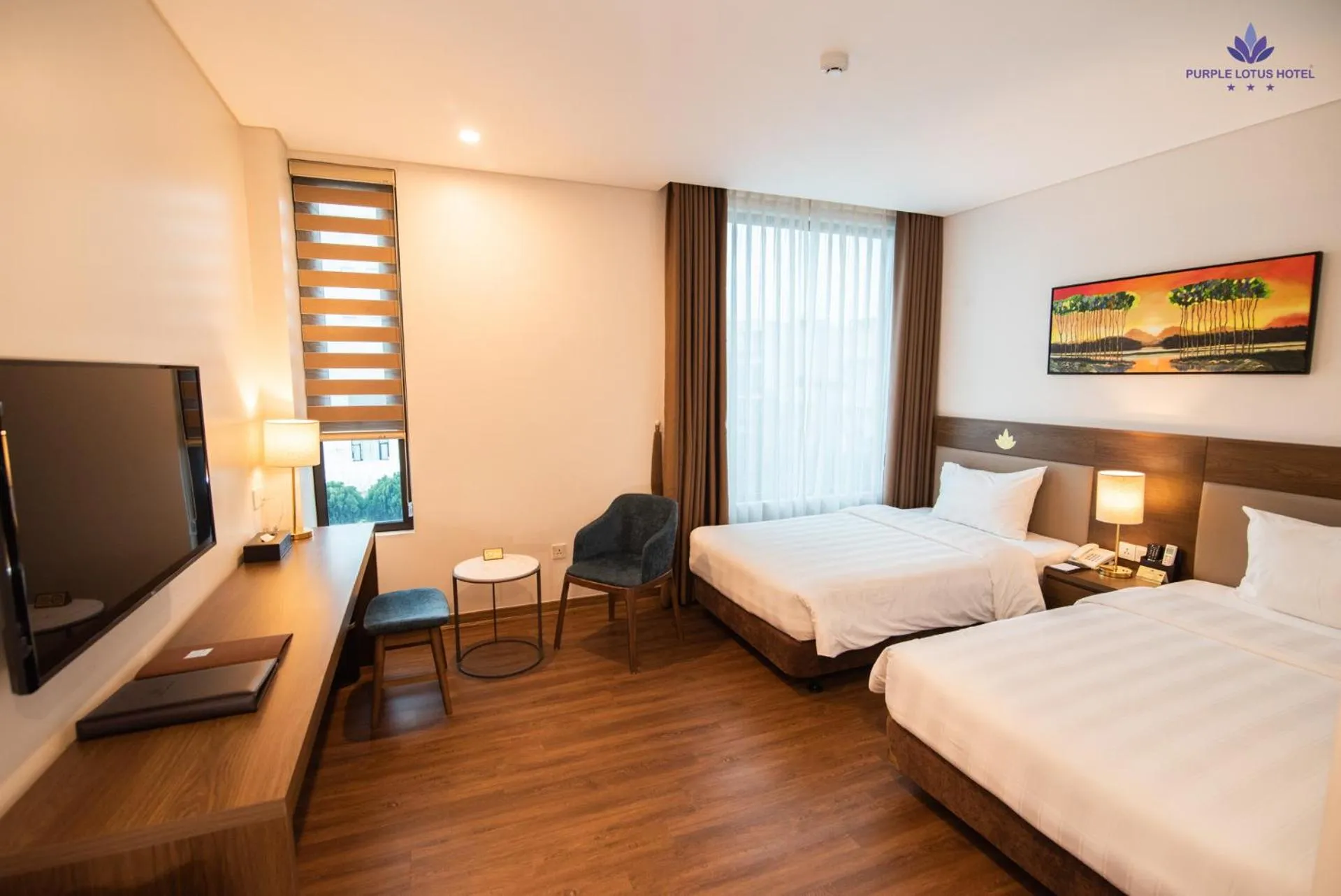 Bed in Purple Lotus Hotel