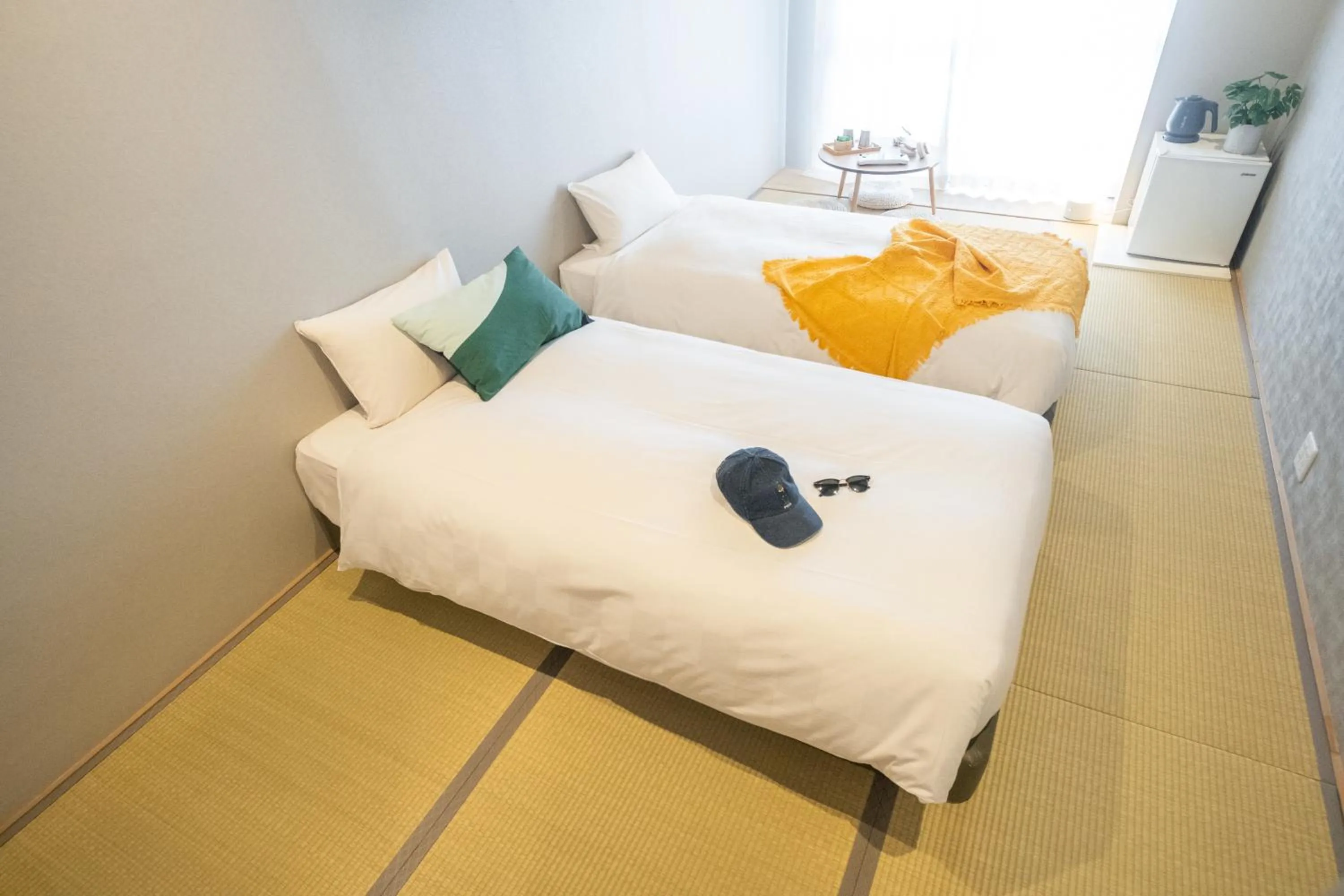 Bed in WAYFARER Kyoto Shijo
