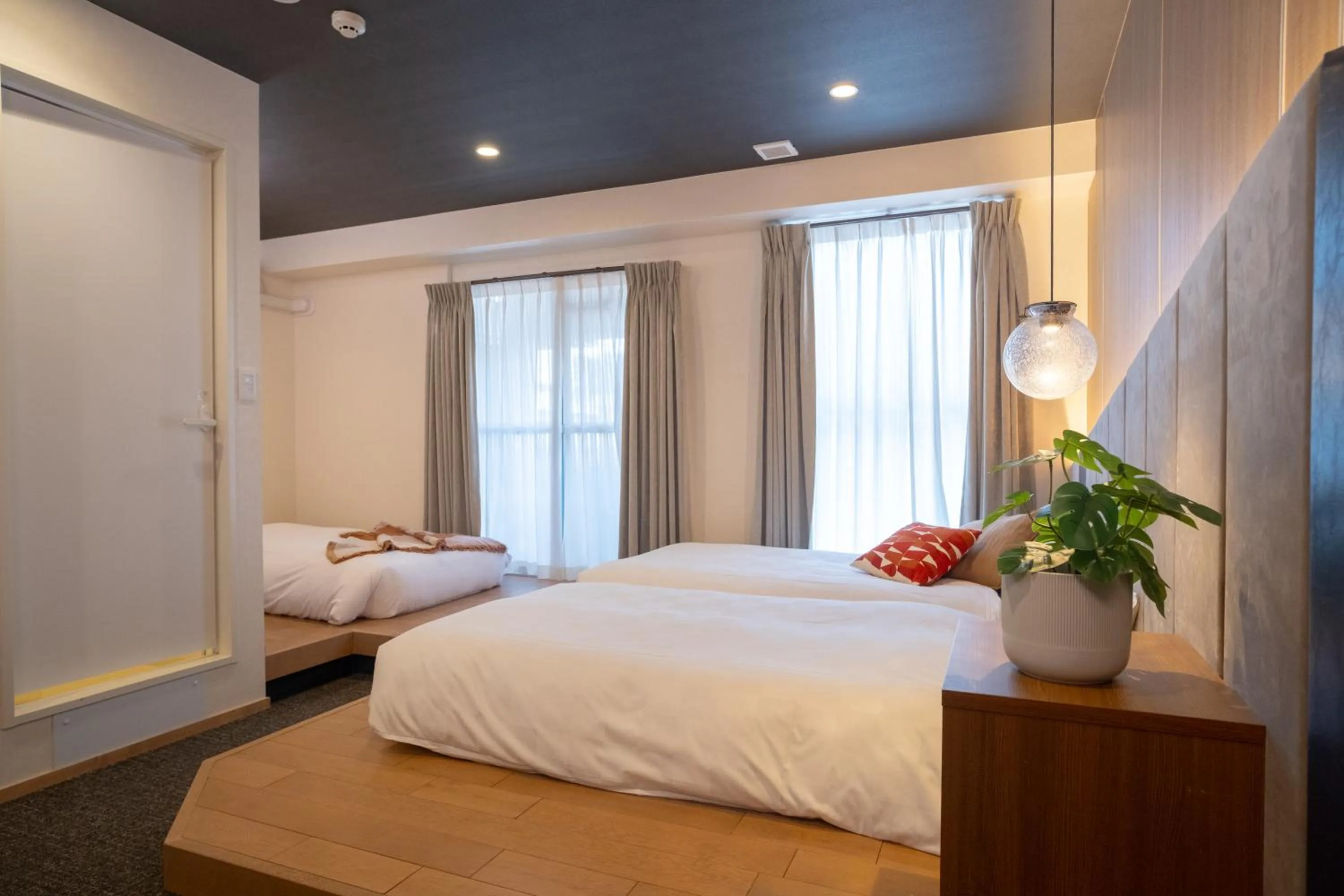 Bed in WAYFARER Kyoto Shijo