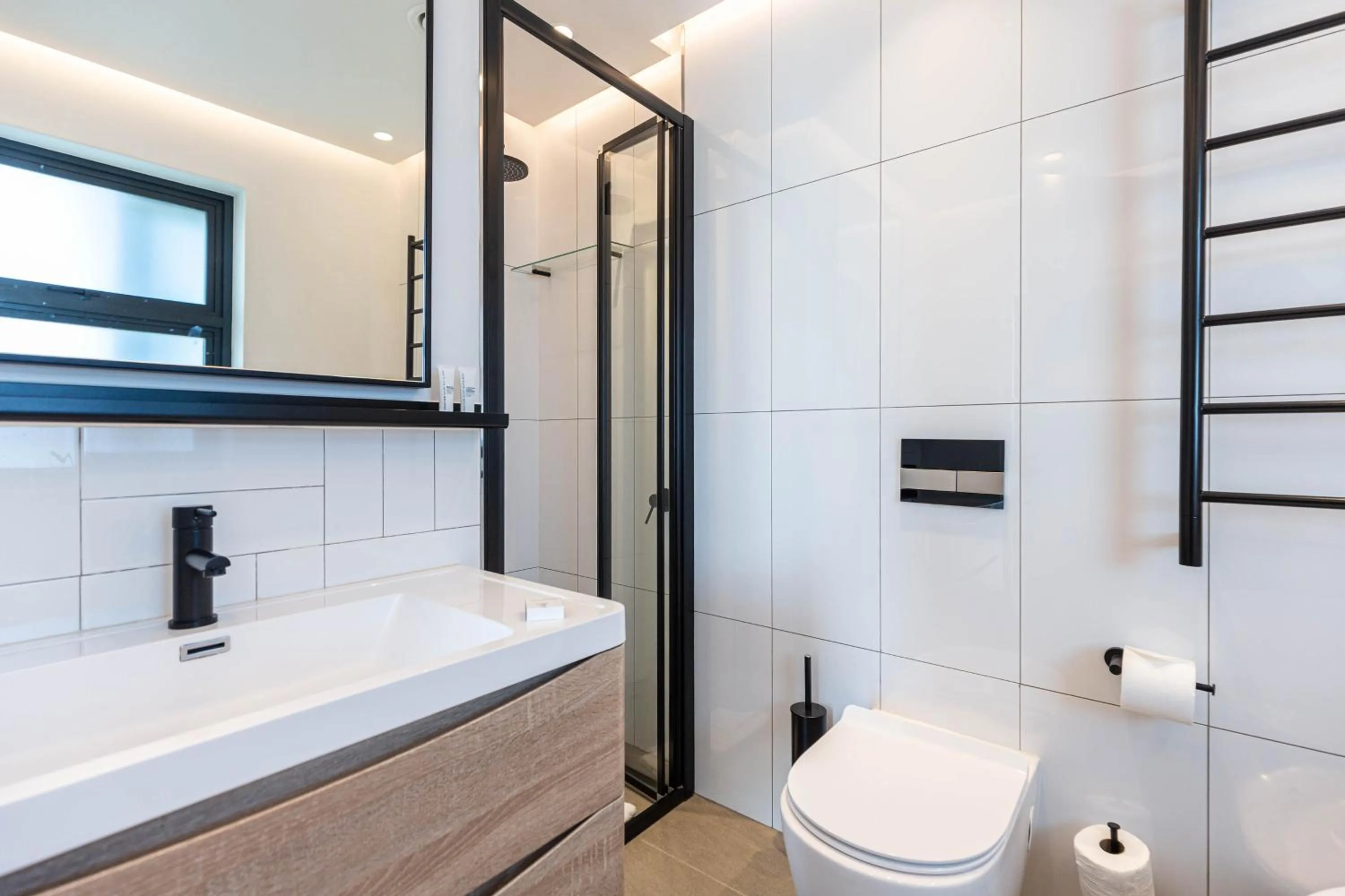 Bathroom in Latitude Aparthotel by Totalstay