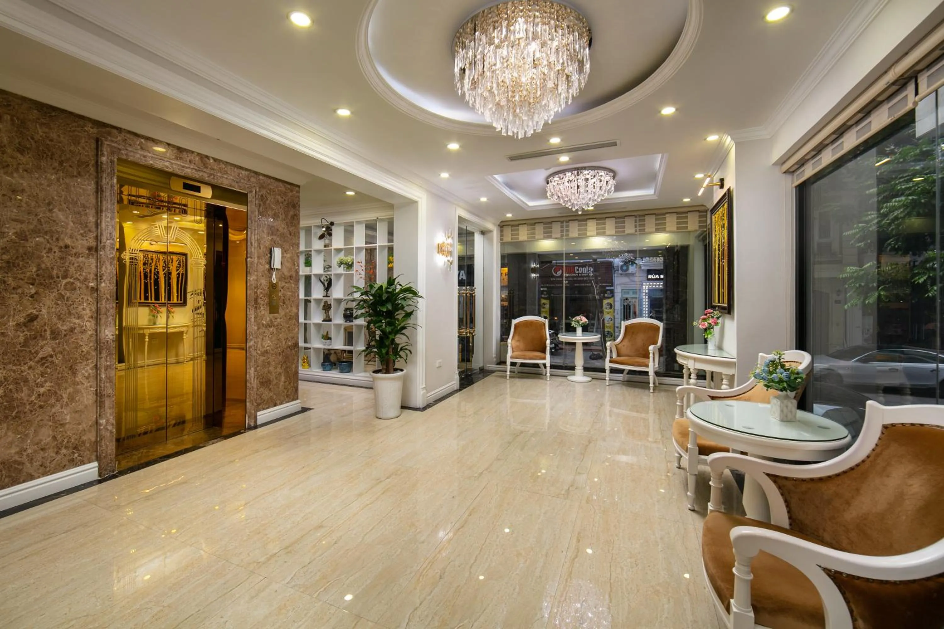 Communal lounge/ TV room in C'Bon Hotel Do Quang