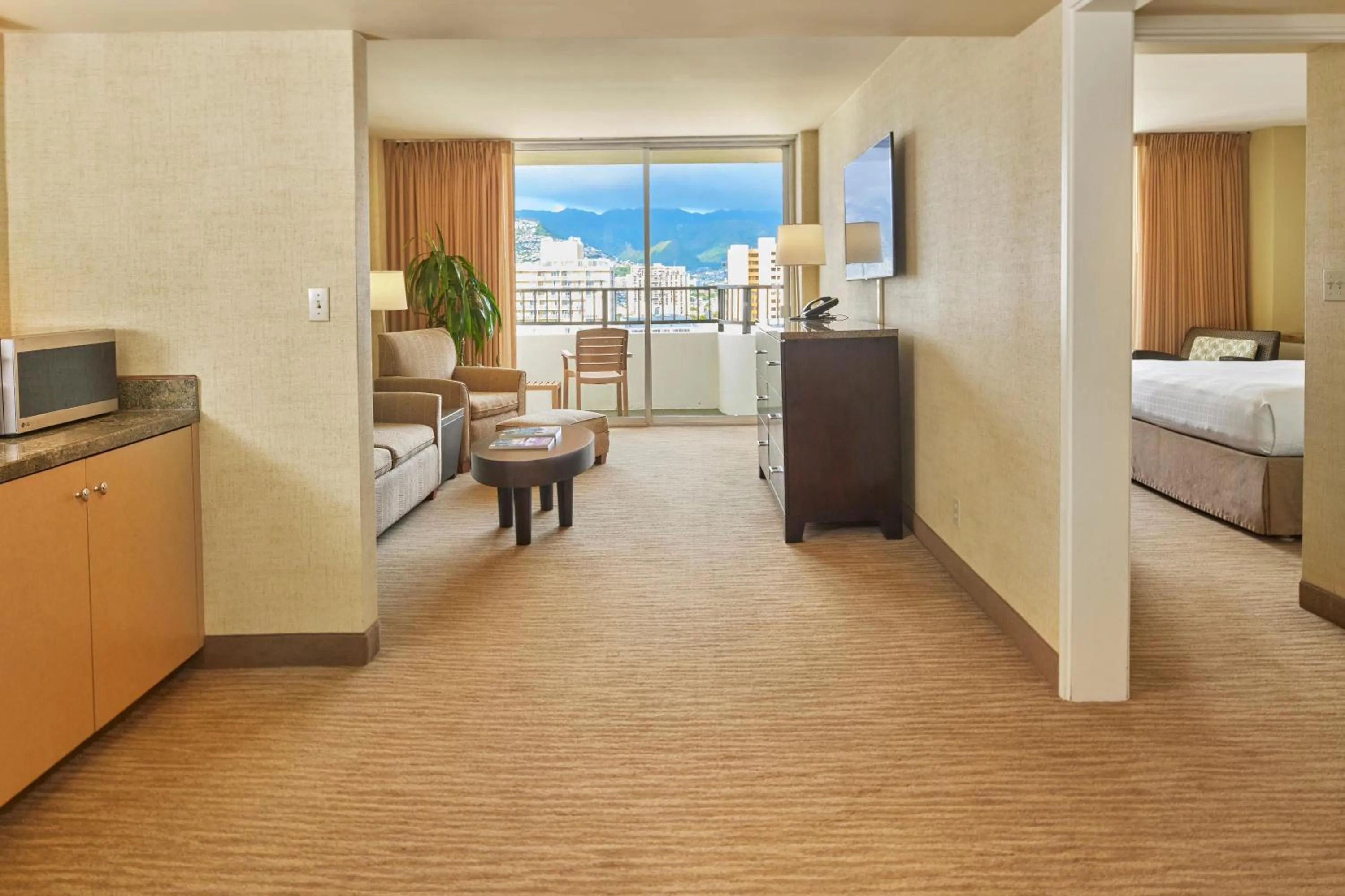 Living room, Bed in Waikiki Resort Hotel