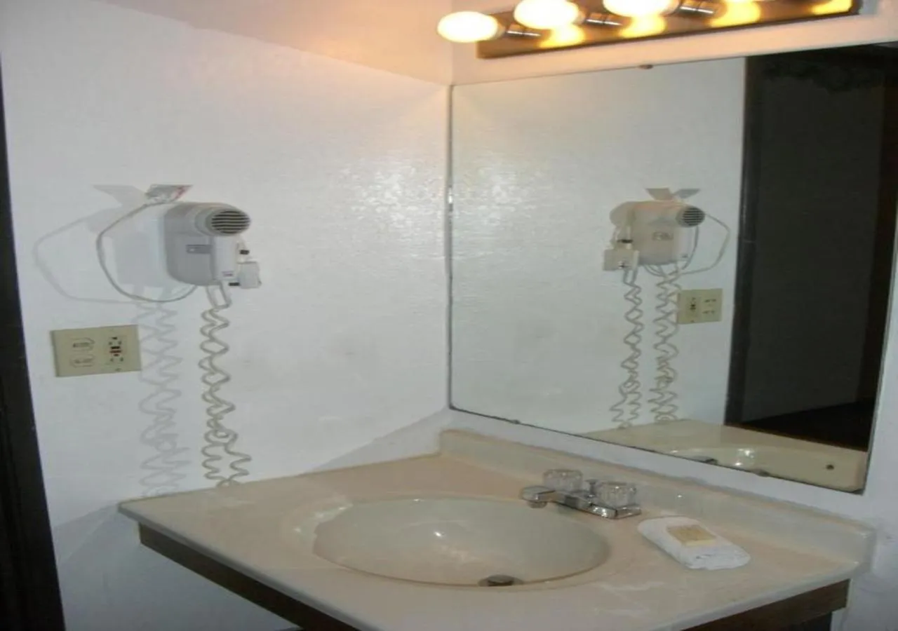 Bathroom in Norwood Inn and Suites - Minneapolis-St Paul Roseville