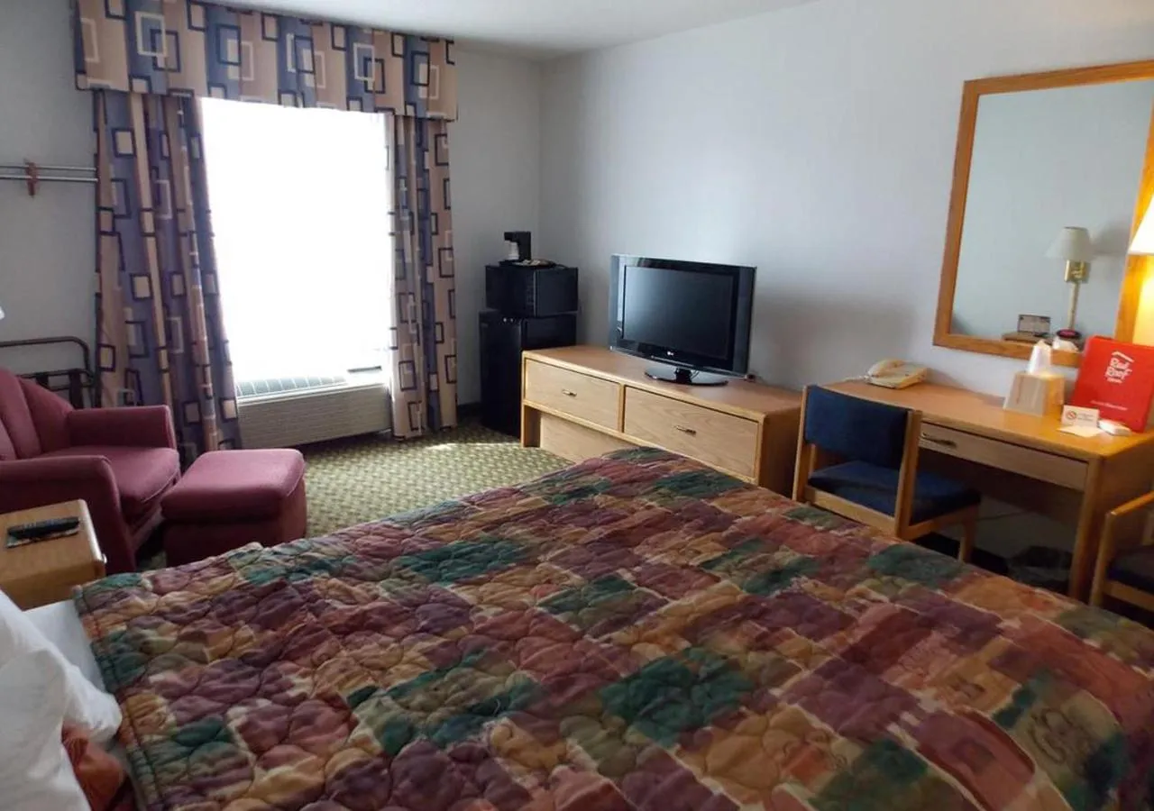 Bed, TV/Entertainment Center in Norwood Inn and Suites - Minneapolis-St Paul Roseville