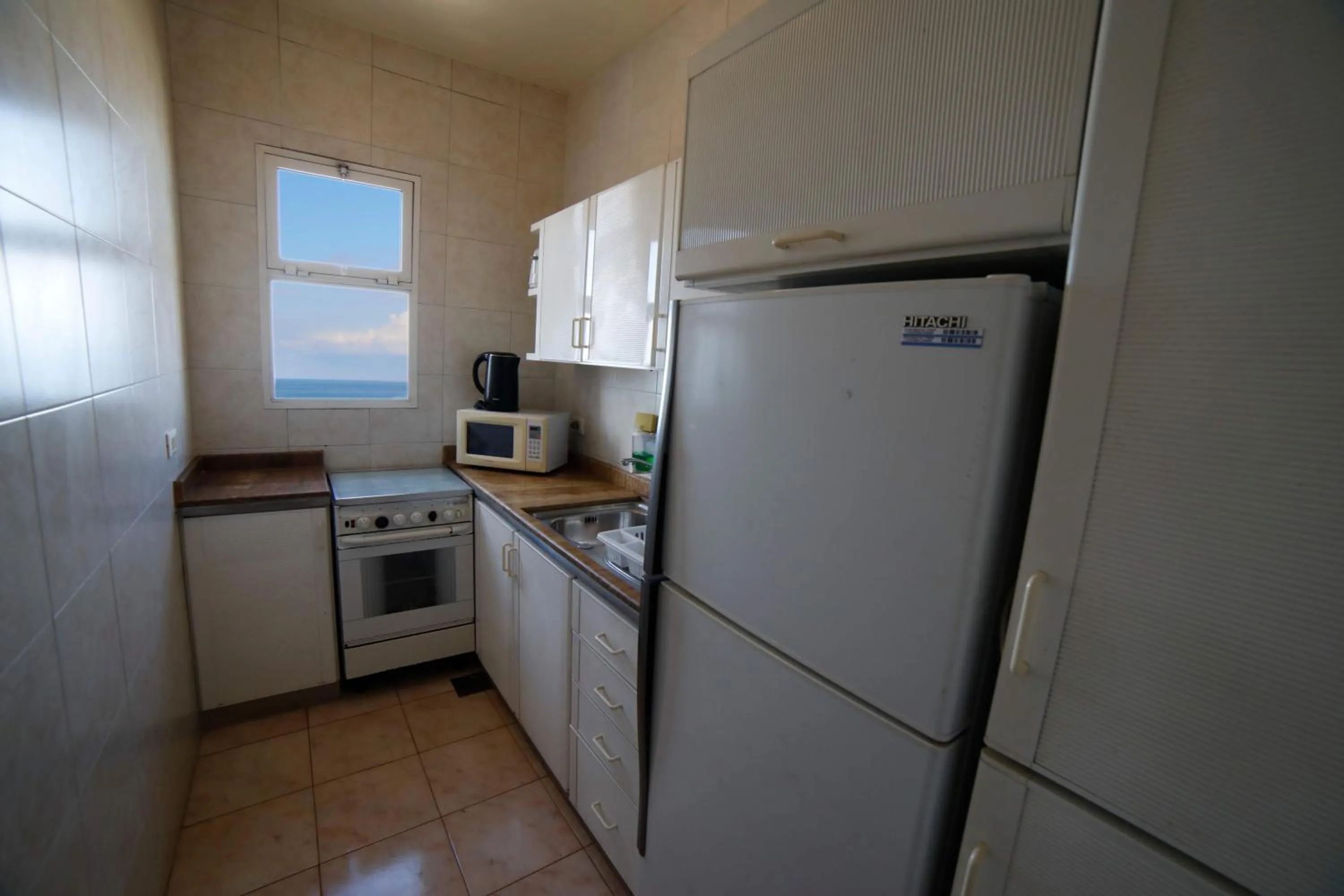 Kitchen or kitchenette in Holiday Home Suites