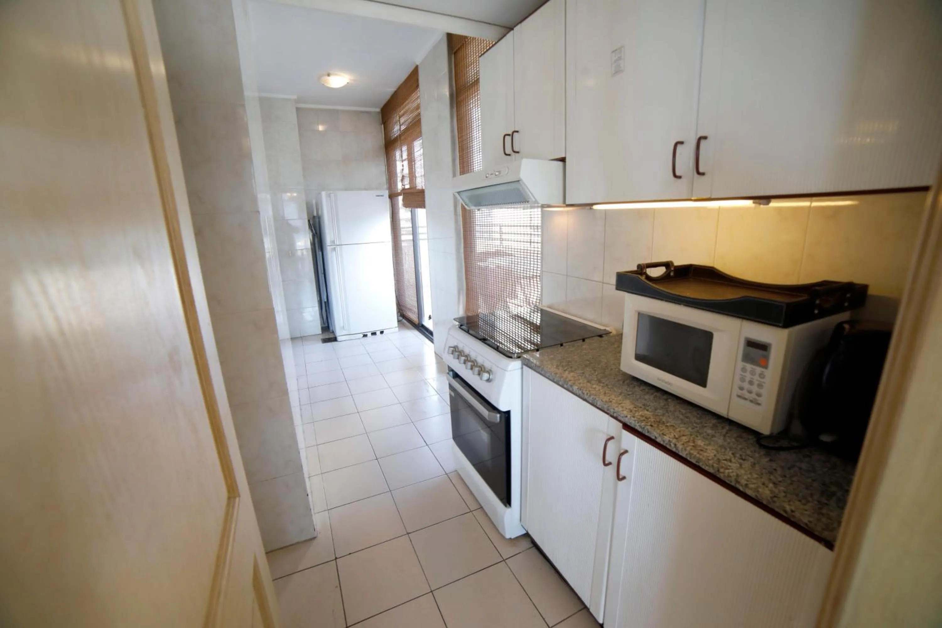 kitchen in Holiday Home Suites