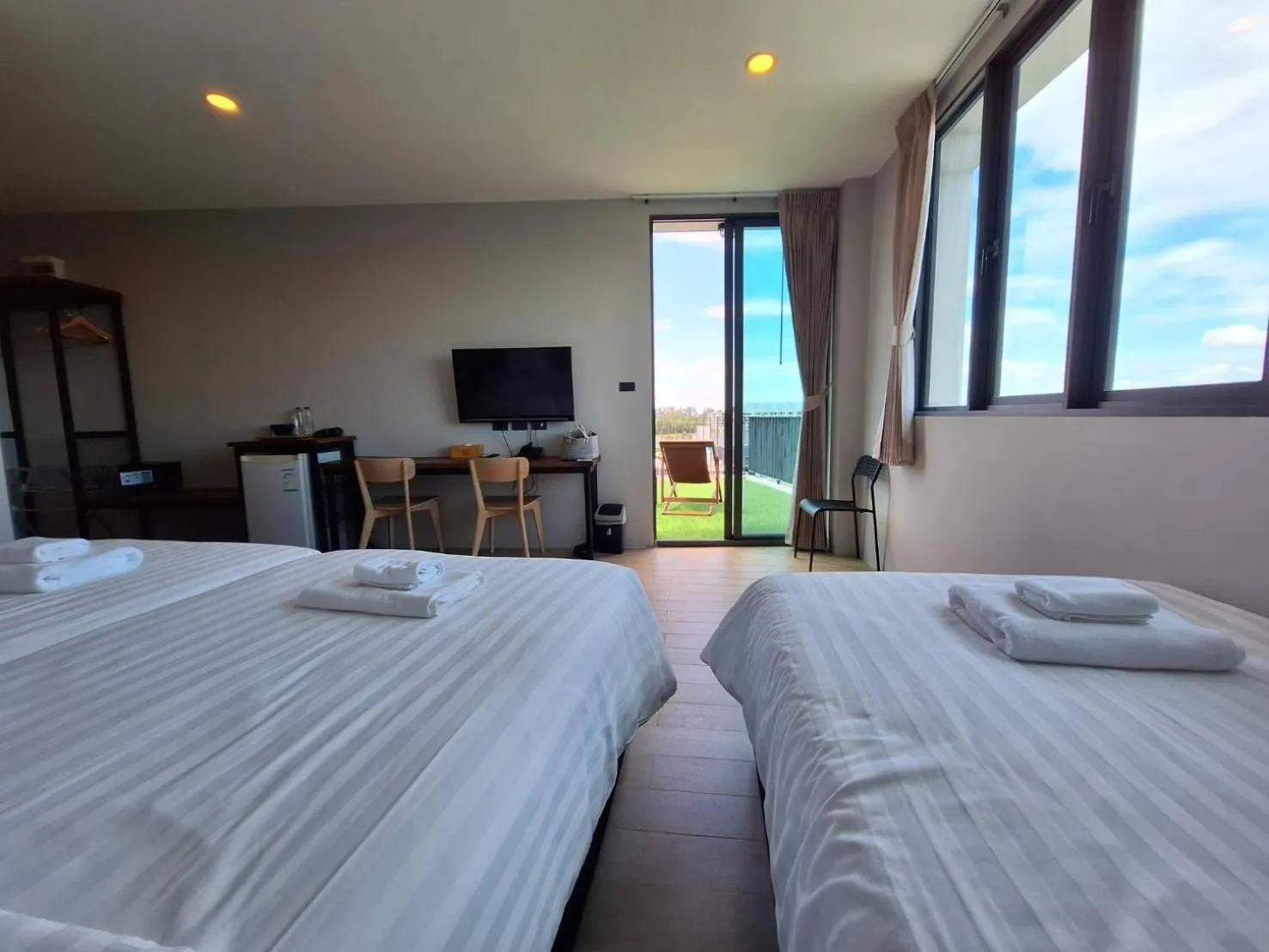 Bed in Atom Phuket Hotel