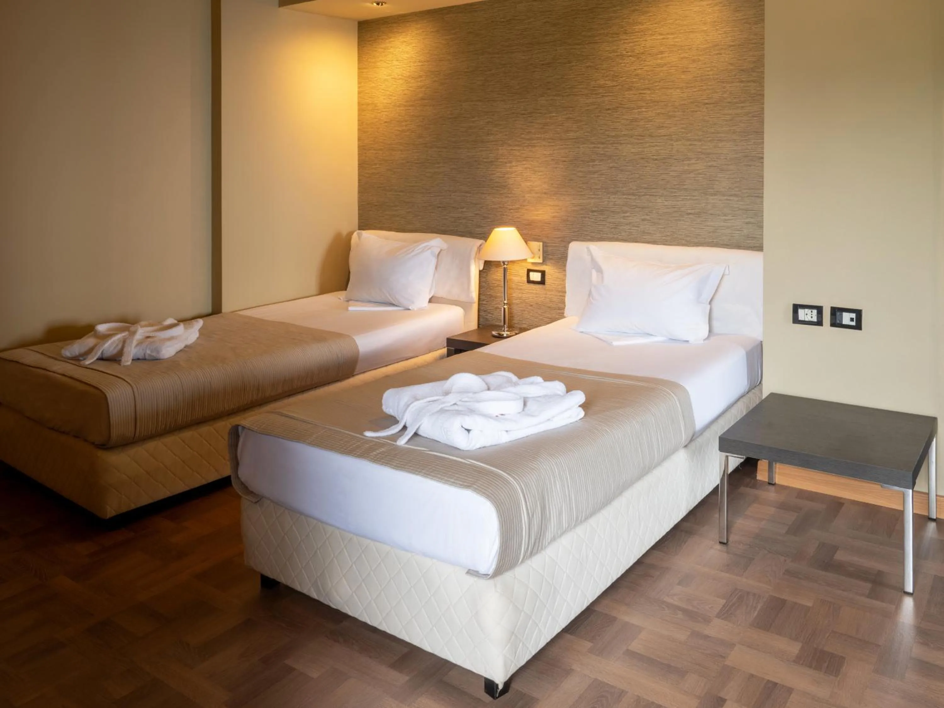 Bed in Rapo's Resort Hotel