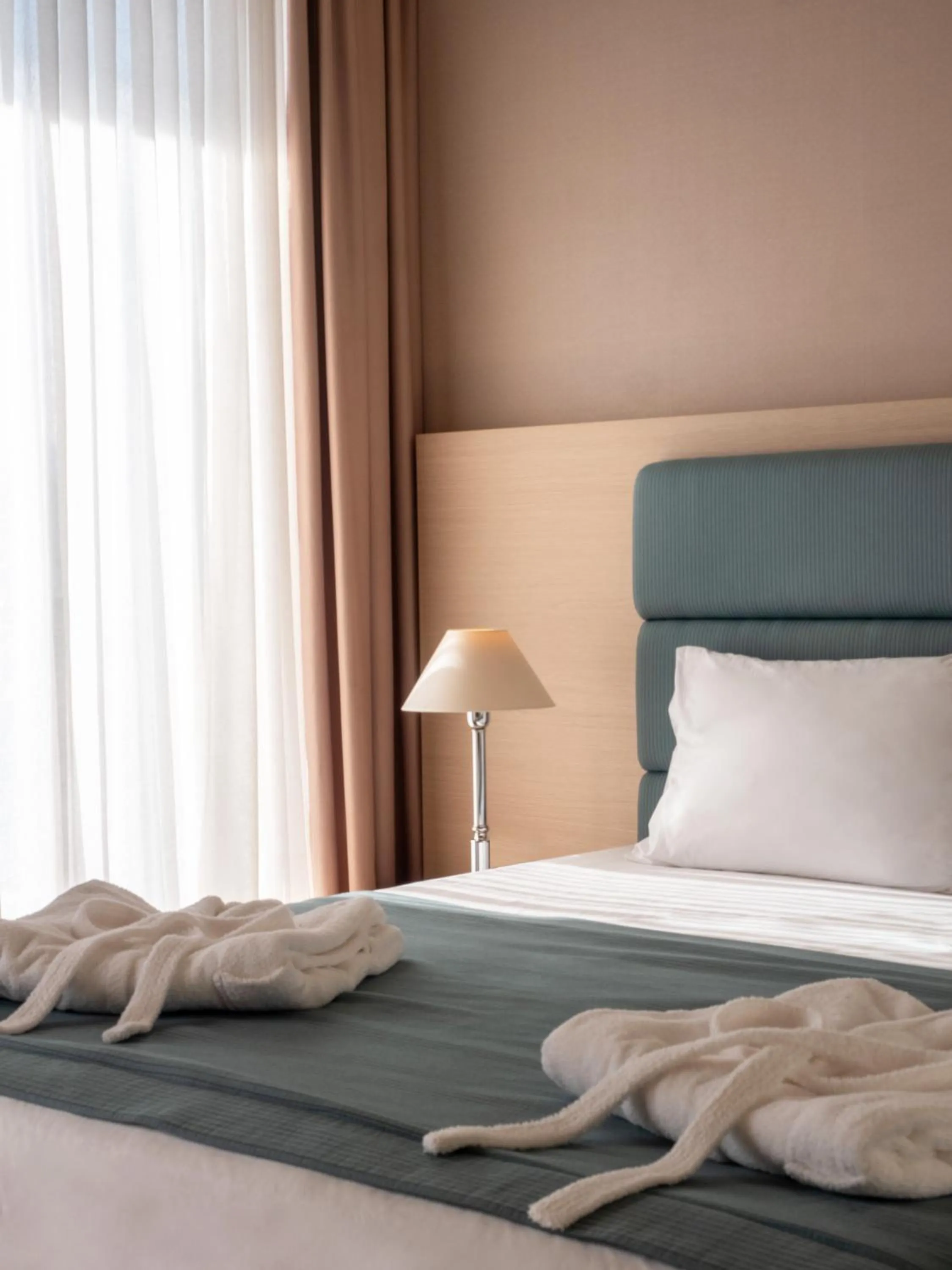 Bed in Rapo's Resort Hotel