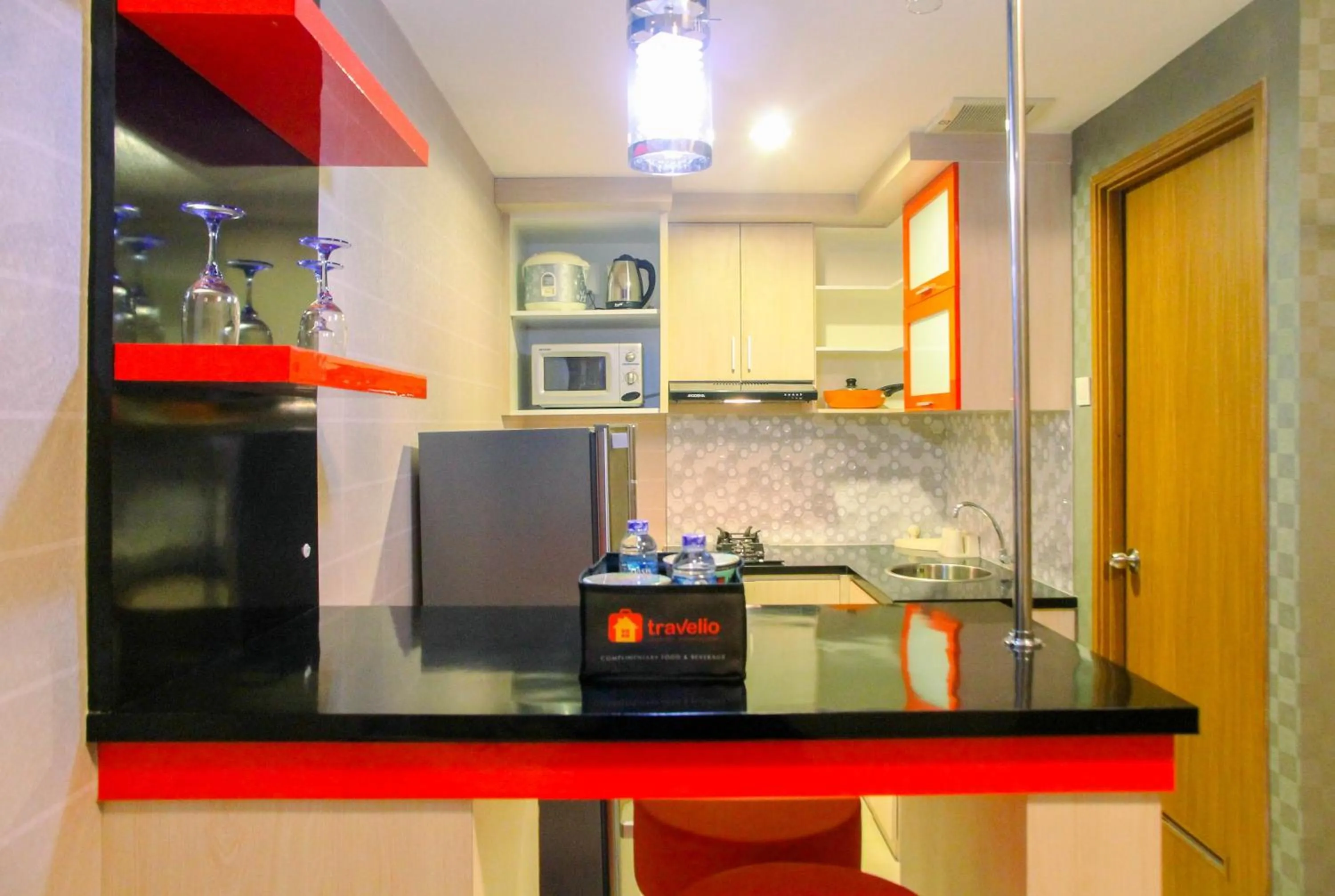 Kitchen or kitchenette in Best Price 1BR Apartment at The Oasis Cikarang By Travelio