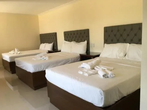 Bed in EM Royalle Hotel & Beach Resort
