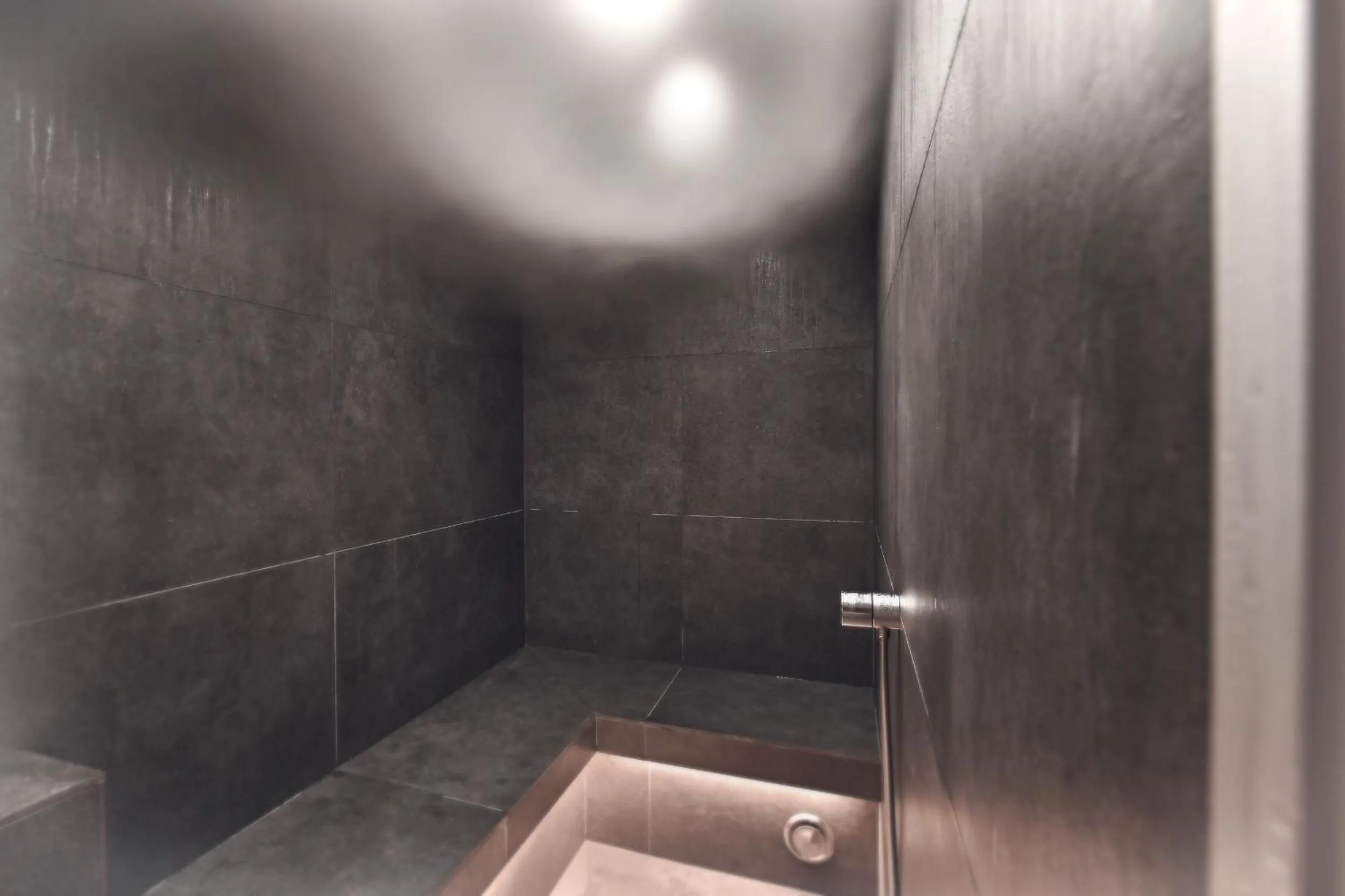 Steam room in Warth52-W52 Apartments