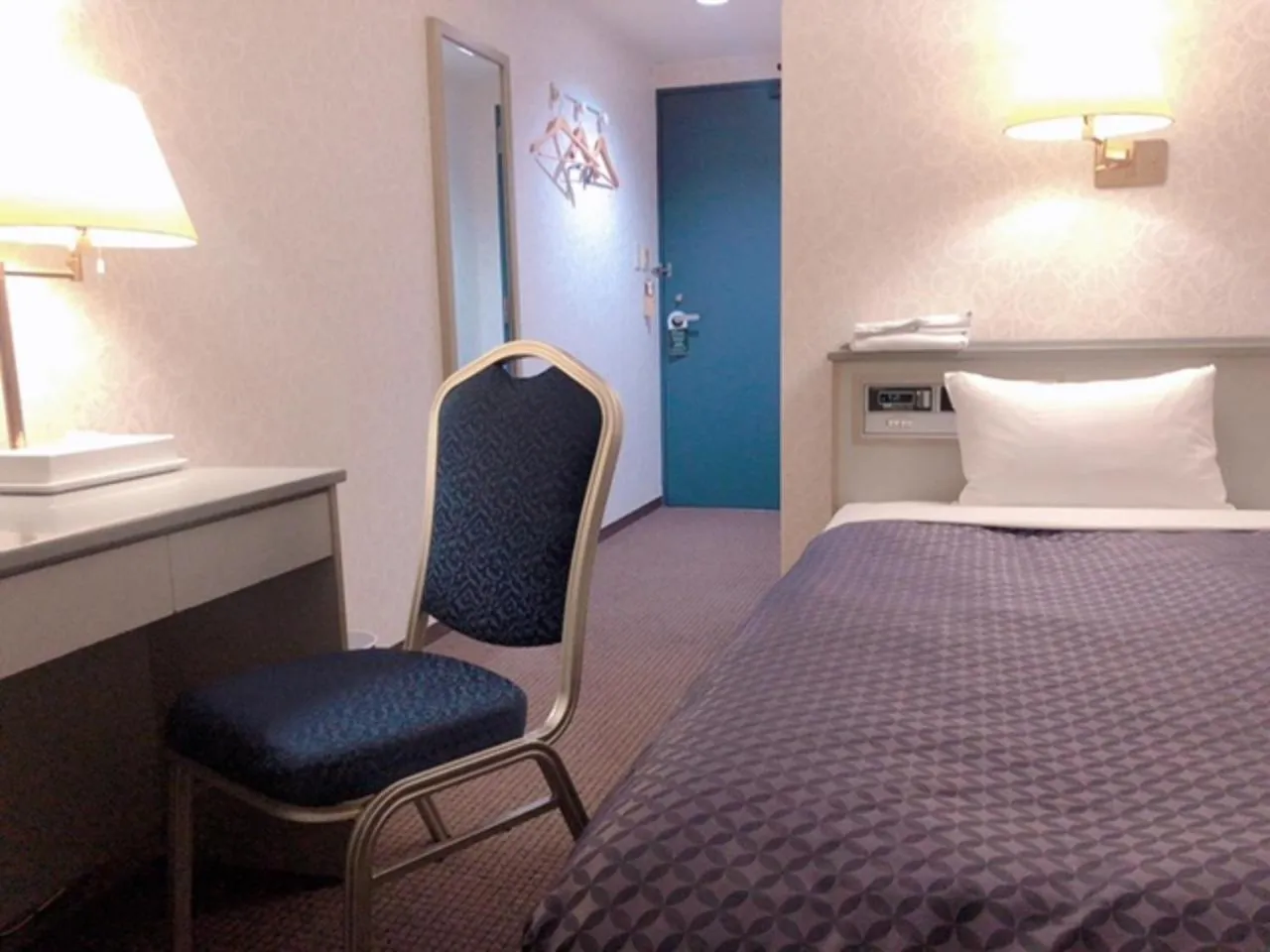 Bed in Seagrande Shimizu Station Hotel