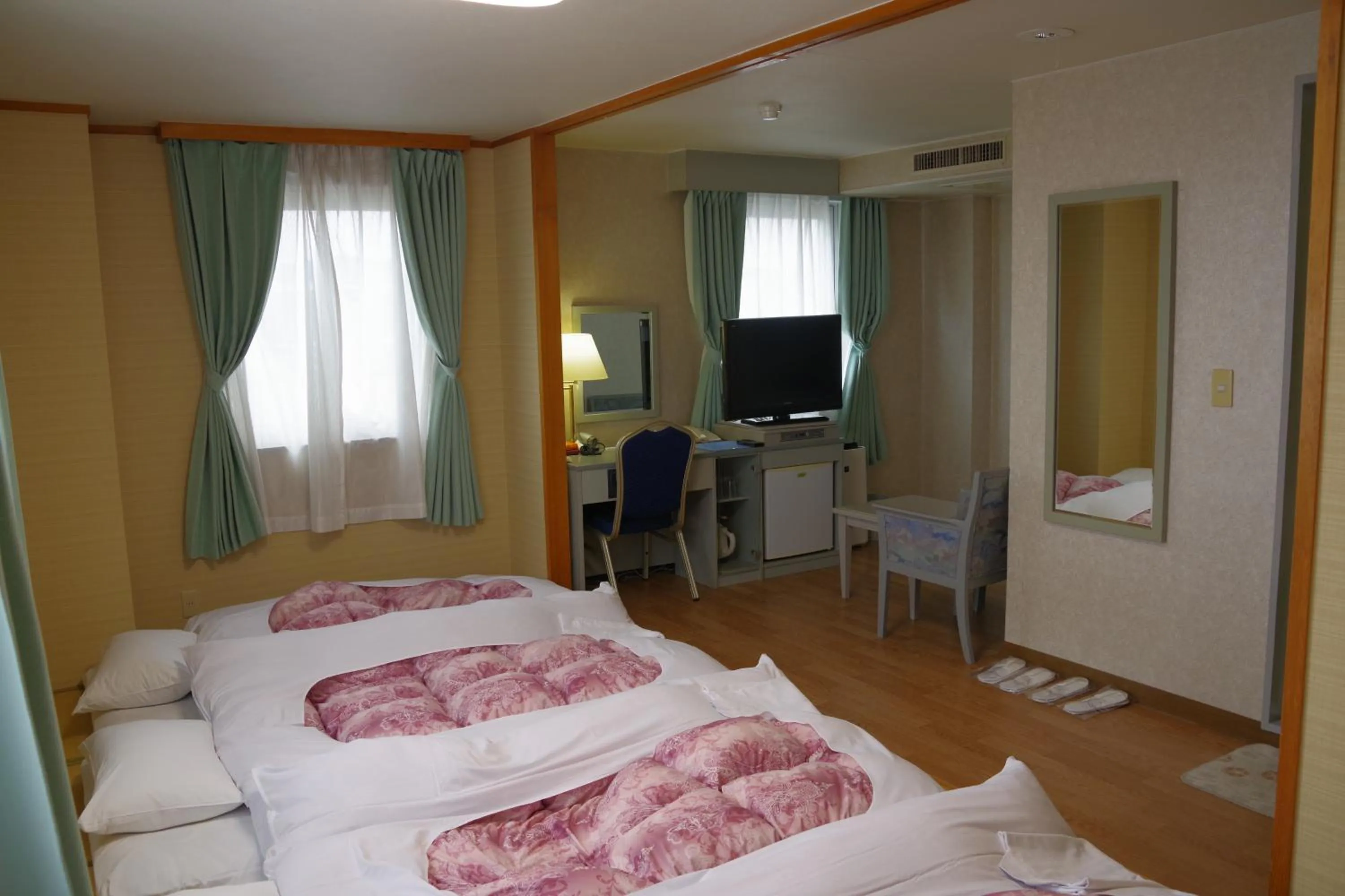 Bed in Seagrande Shimizu Station Hotel