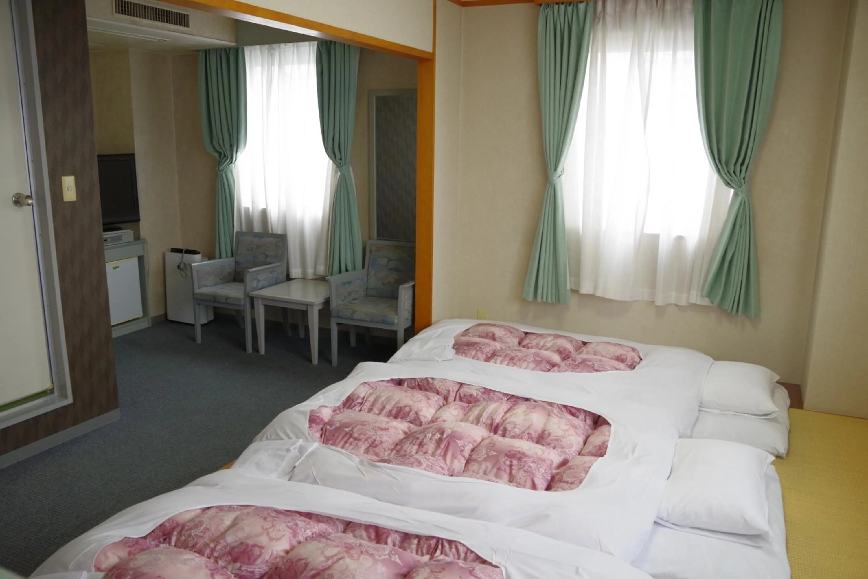 Bed in Seagrande Shimizu Station Hotel