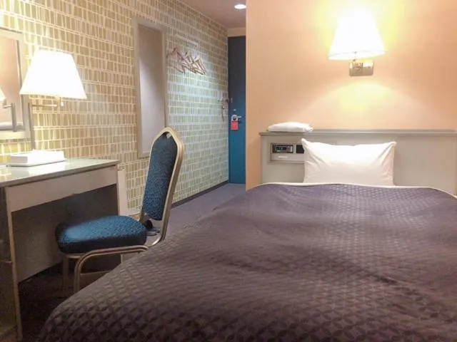 Bed in Seagrande Shimizu Station Hotel