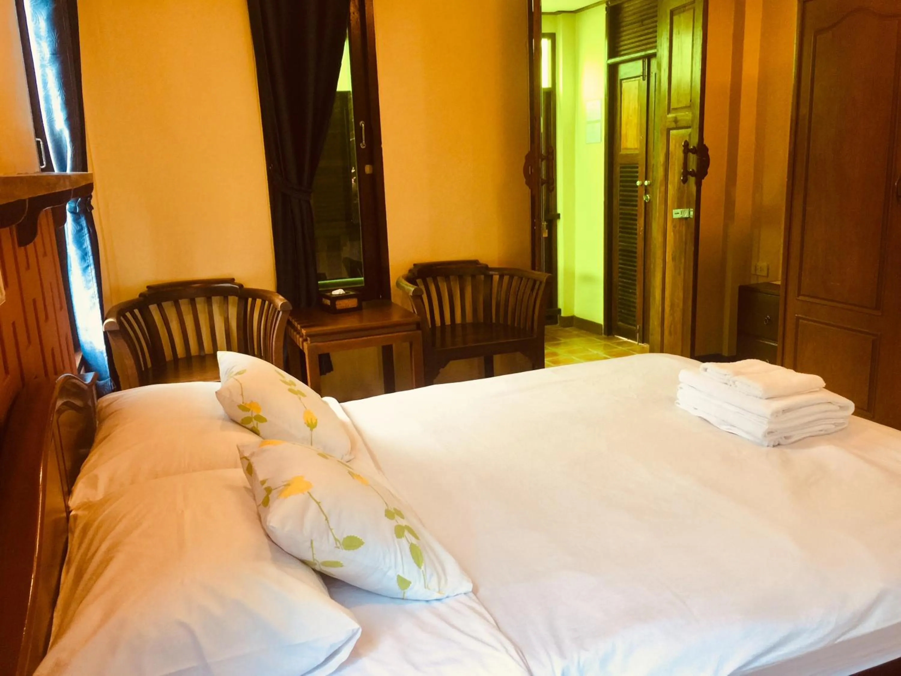 Photo of the whole room, Bed in Luang Chumni Village