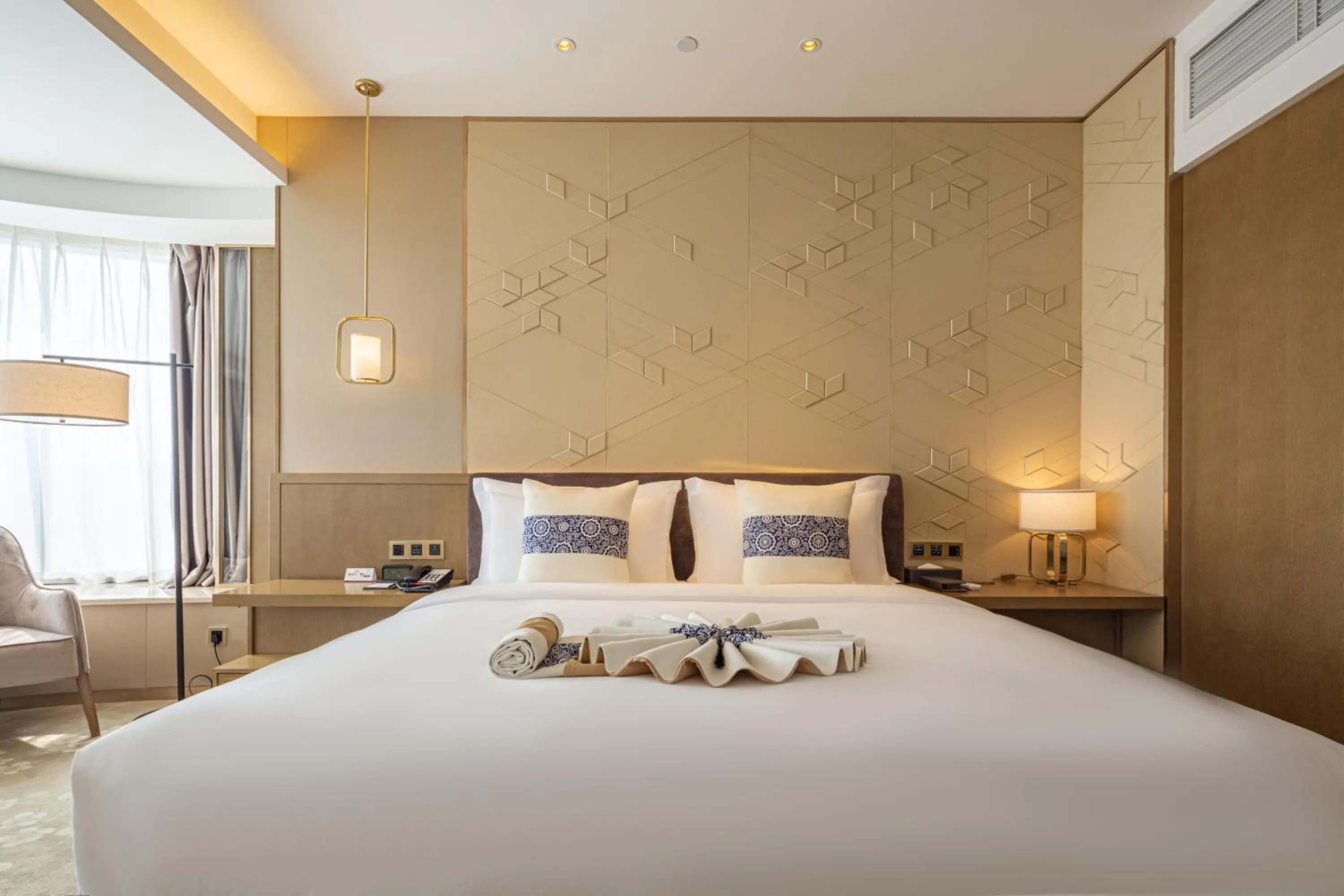 Bed in LIUZHOU PENGYI Hotel