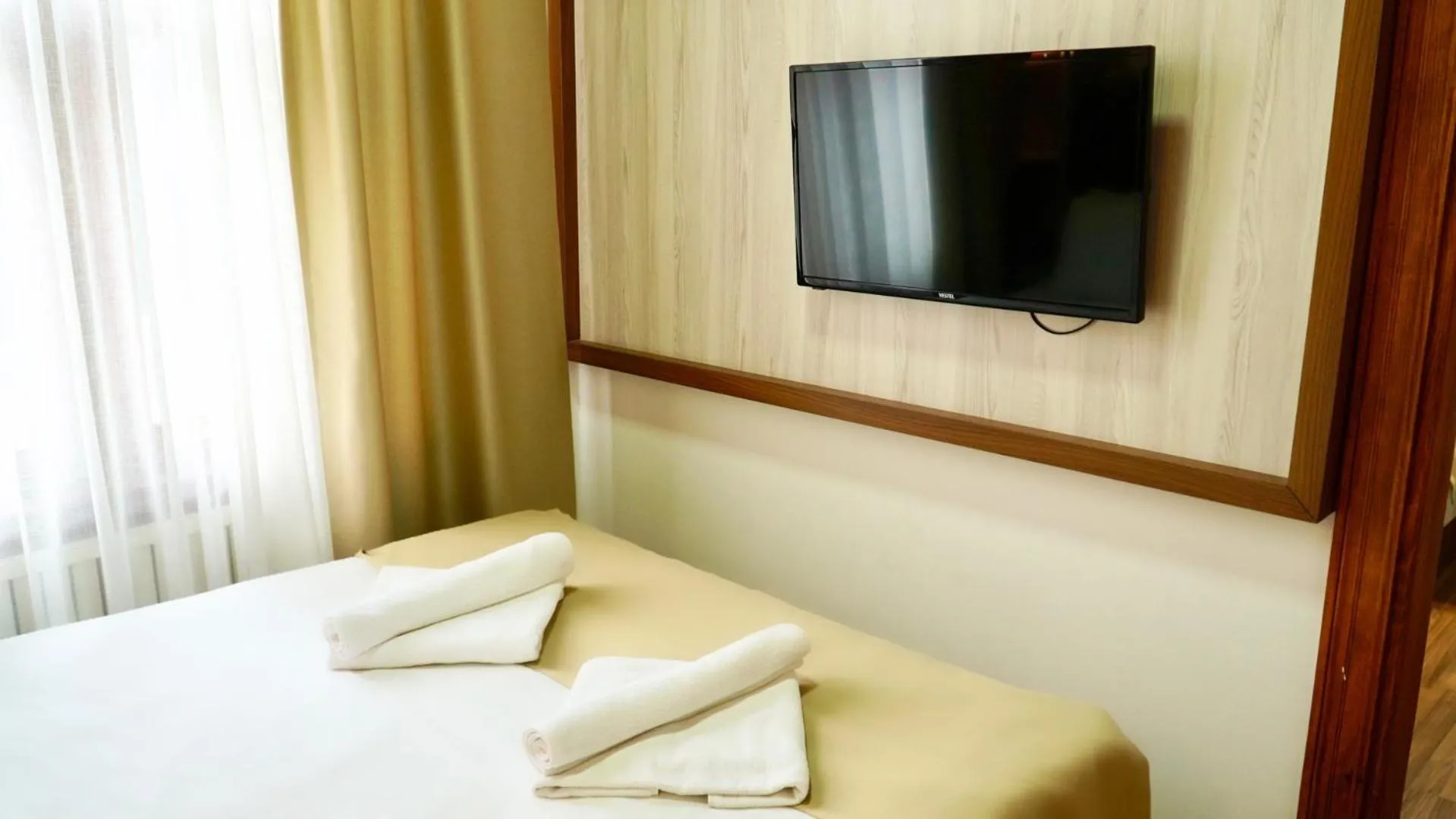 Bedroom in QONAQ HOTEL & SUITES