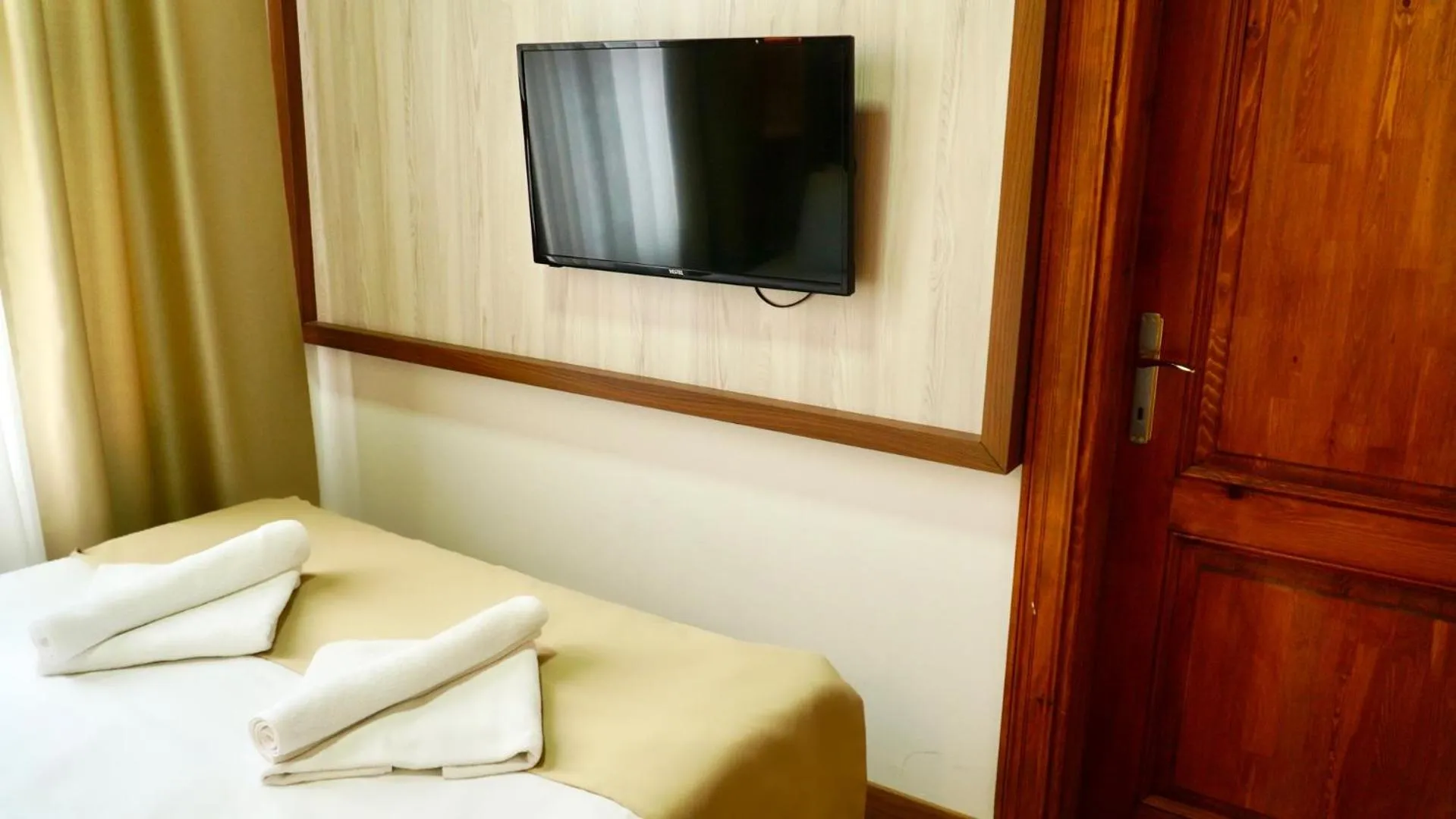 Bedroom in QONAQ HOTEL & SUITES