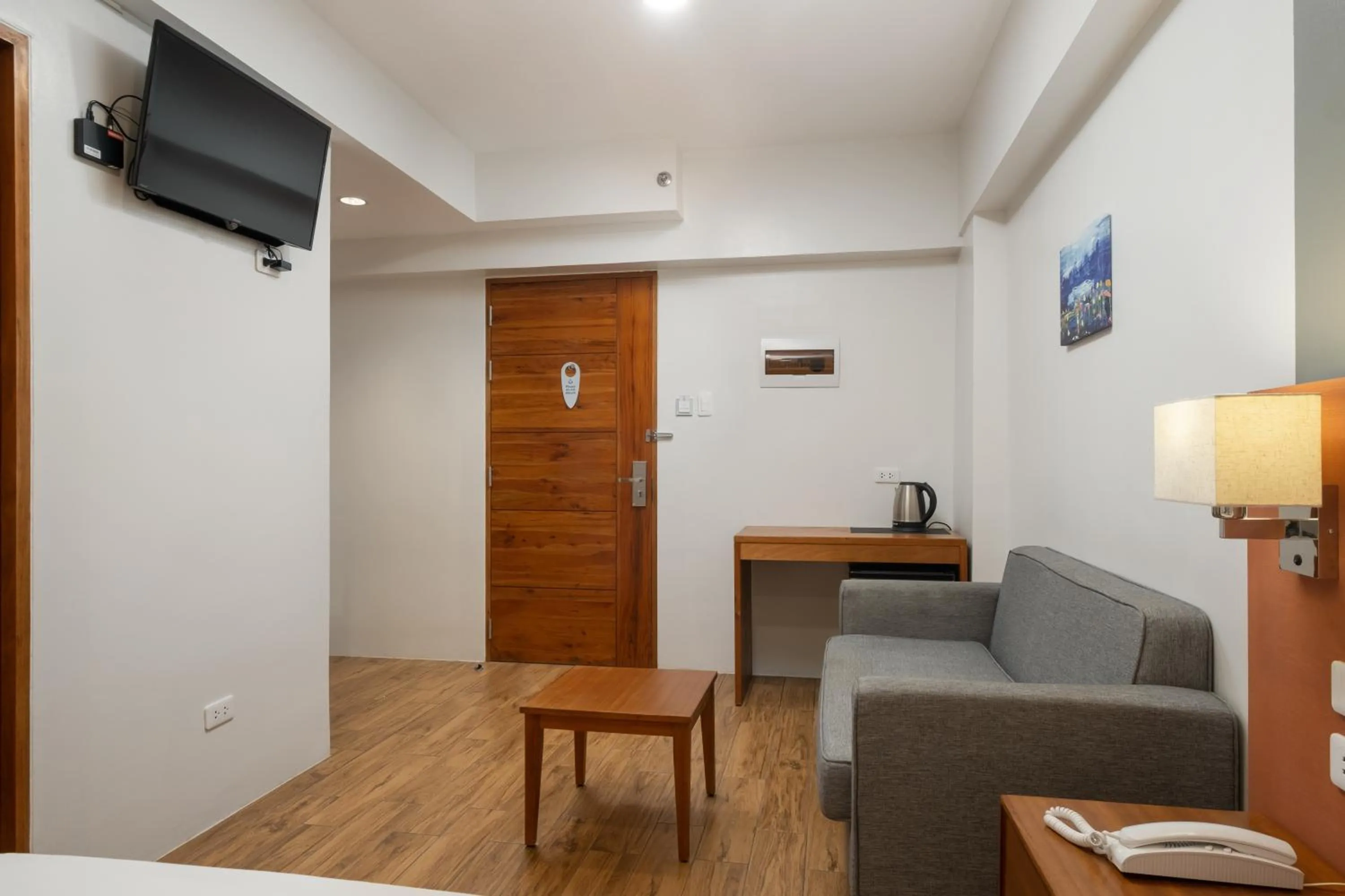 Seating area in iHotel Uptown BGC