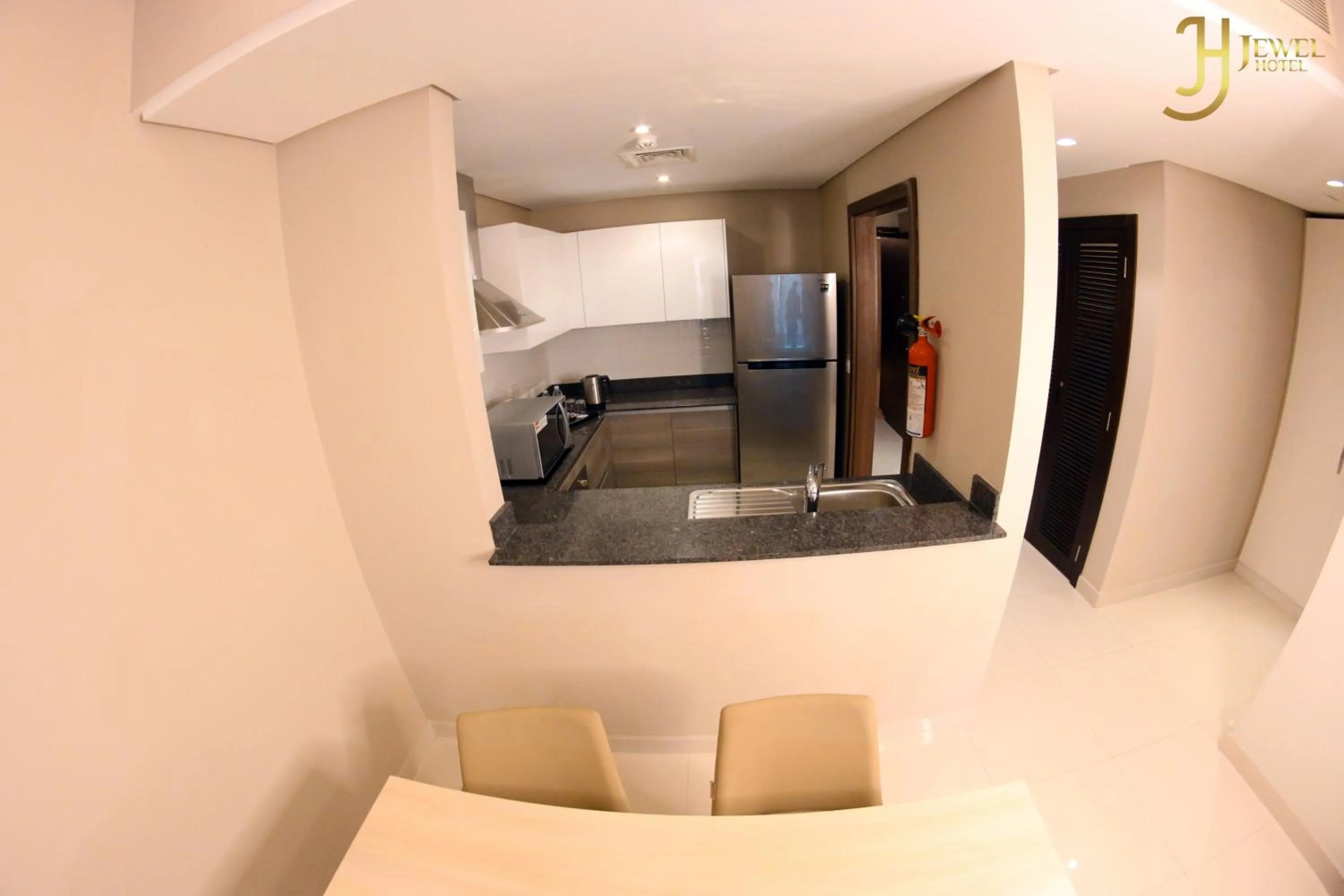 Kitchen or kitchenette, Bed in Sunday Luxury Downtown Adliya Formerly Jewel Hotel