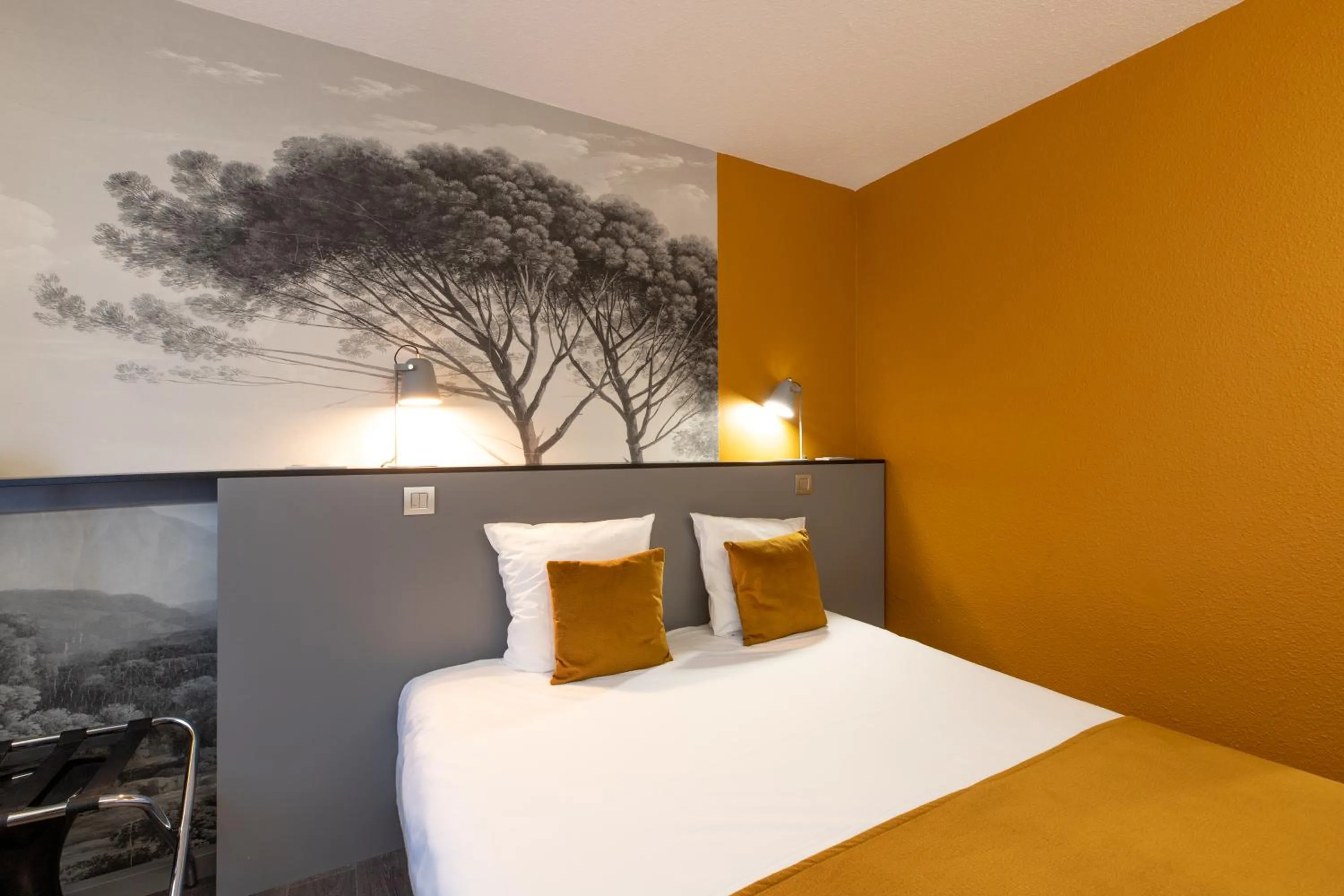 Bed in Logis Hôtel du Haut-Bugey