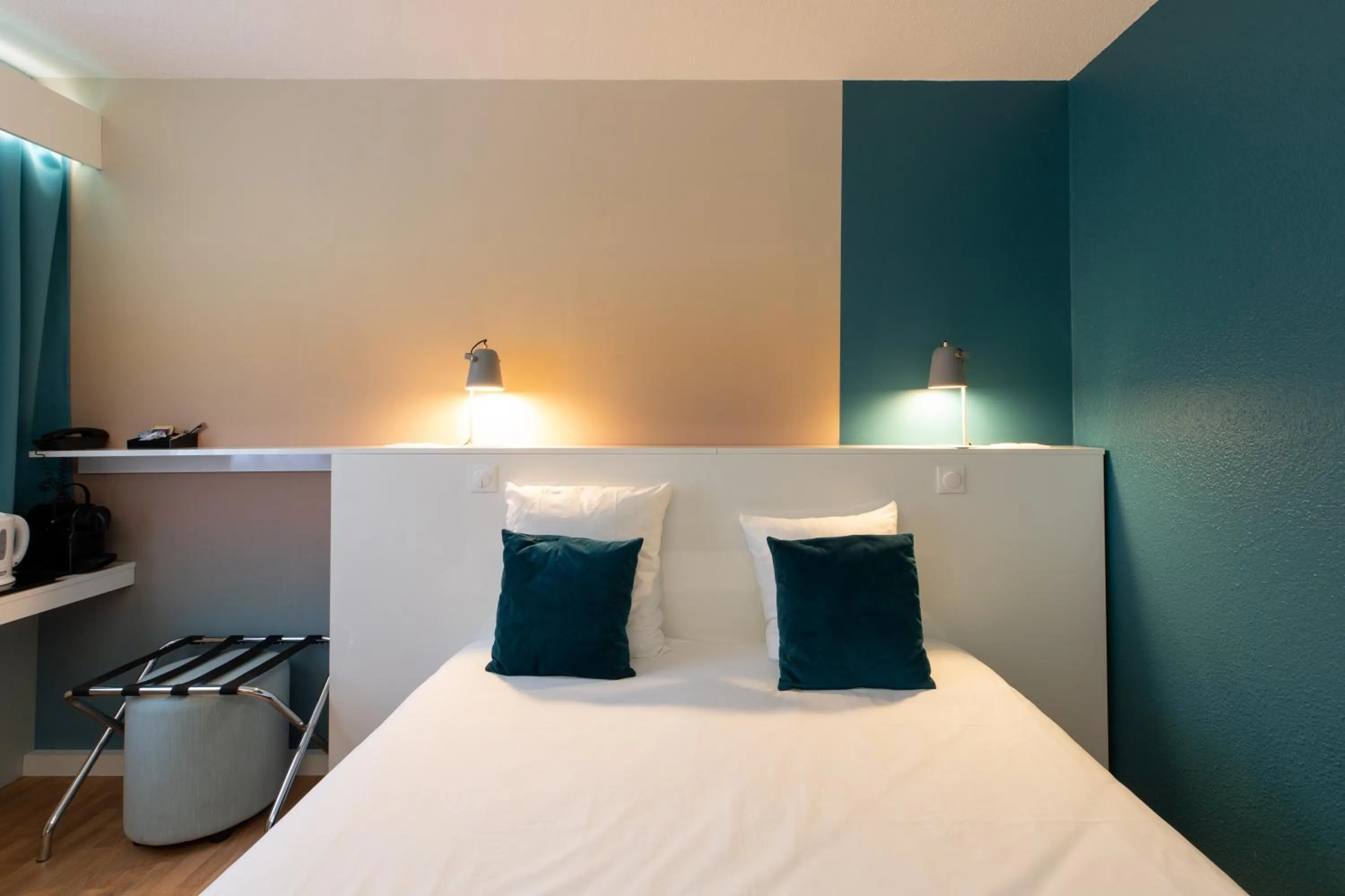 Bed in Logis Hôtel du Haut-Bugey