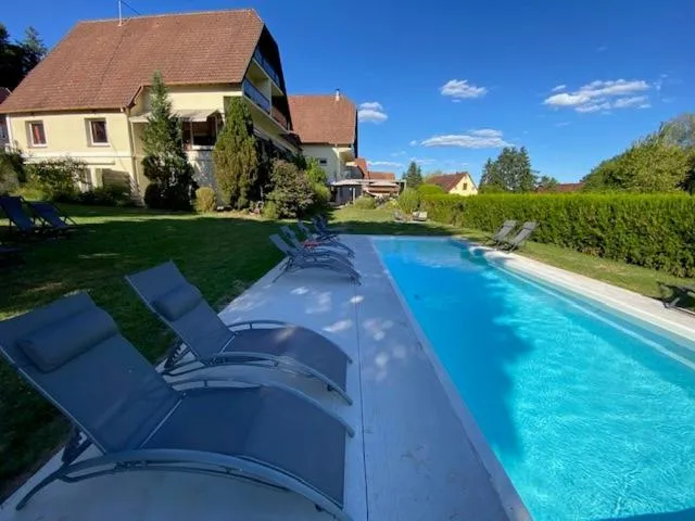 Swimming pool in Hôtel Restaurant La Couronne by K